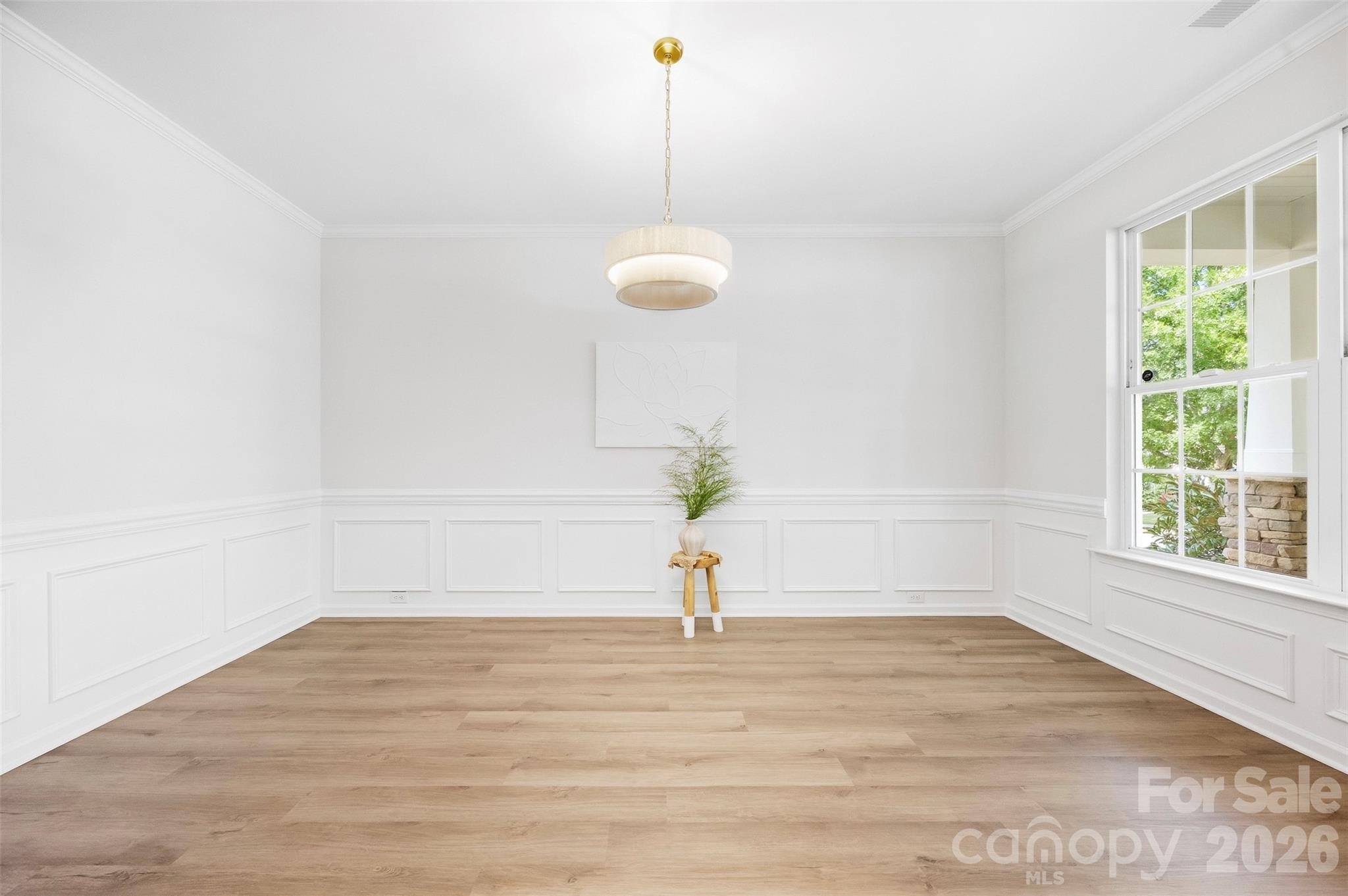 Beautifully refreshed main level features new LVP flooring throughout, fresh paint, and updated lighting for a bright, cohesive look - 2015 Kensley Drive, Waxhaw