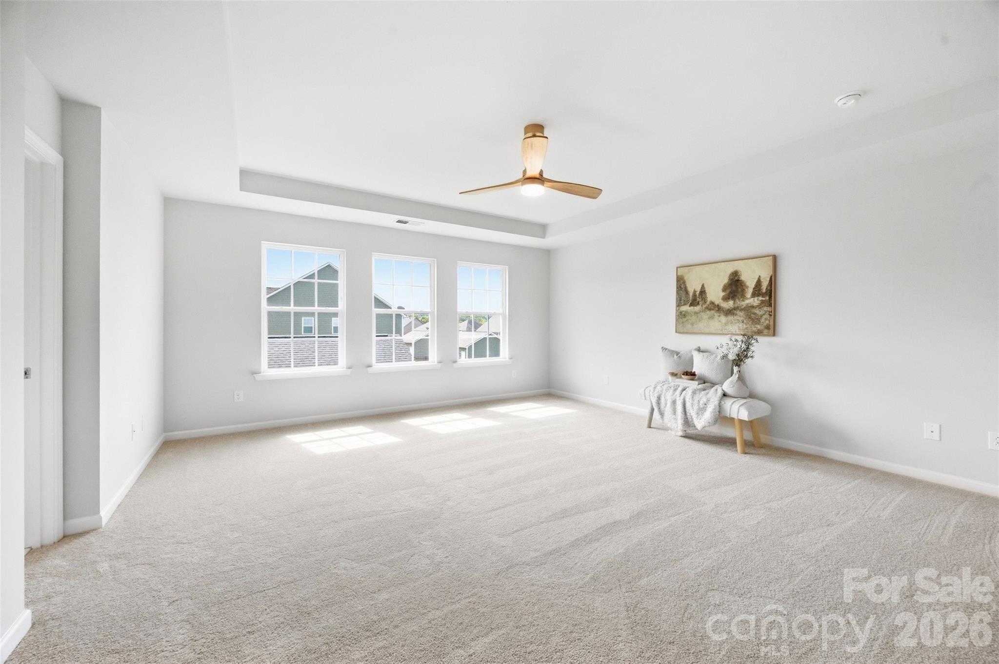 Freshly painted primary suite with brand-new carpeting creates a clean, move-in-ready retreat - 2015 Kensley Drive, Waxhaw