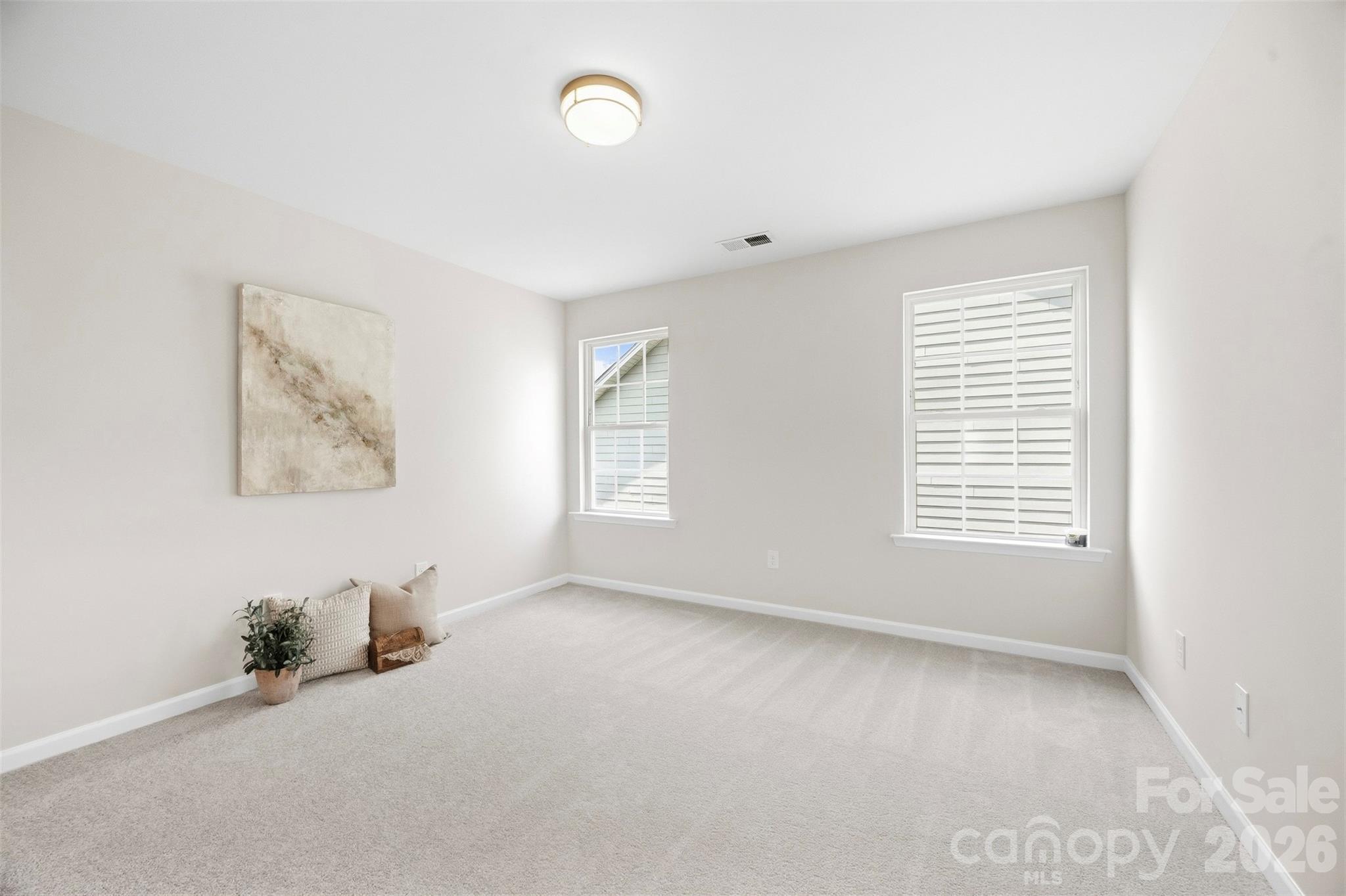 Bedrooms has been refreshed with new carpet, fresh paint, and a new light fixture - 2015 Kensley Drive, Waxhaw