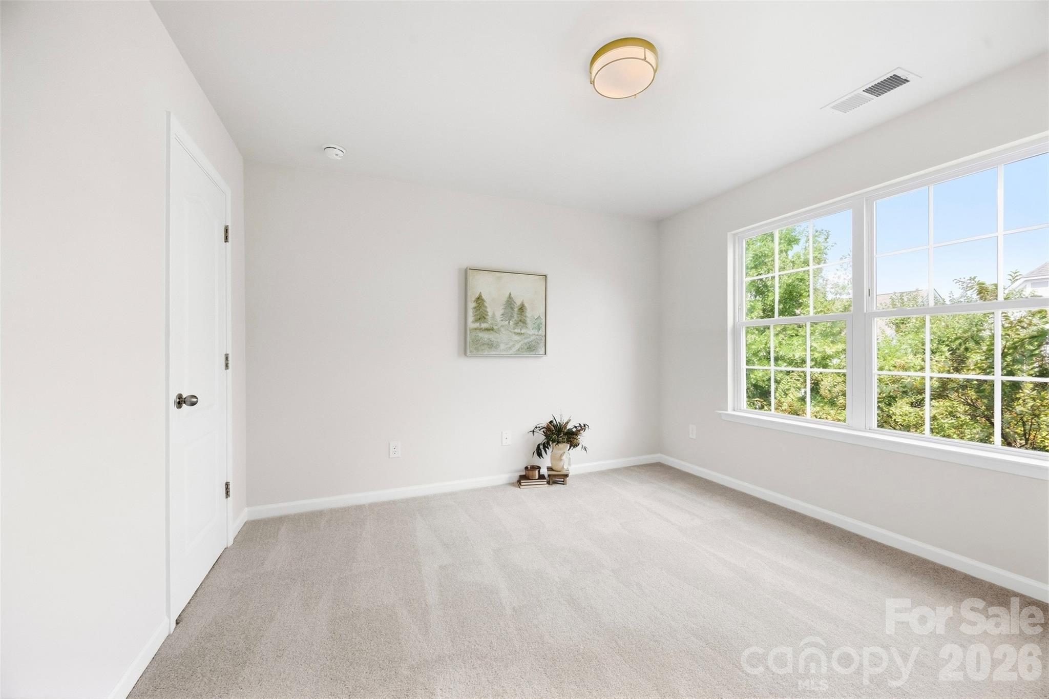 Bedrooms has been refreshed with new carpet, fresh paint, and a new light fixture - 2015 Kensley Drive, Waxhaw