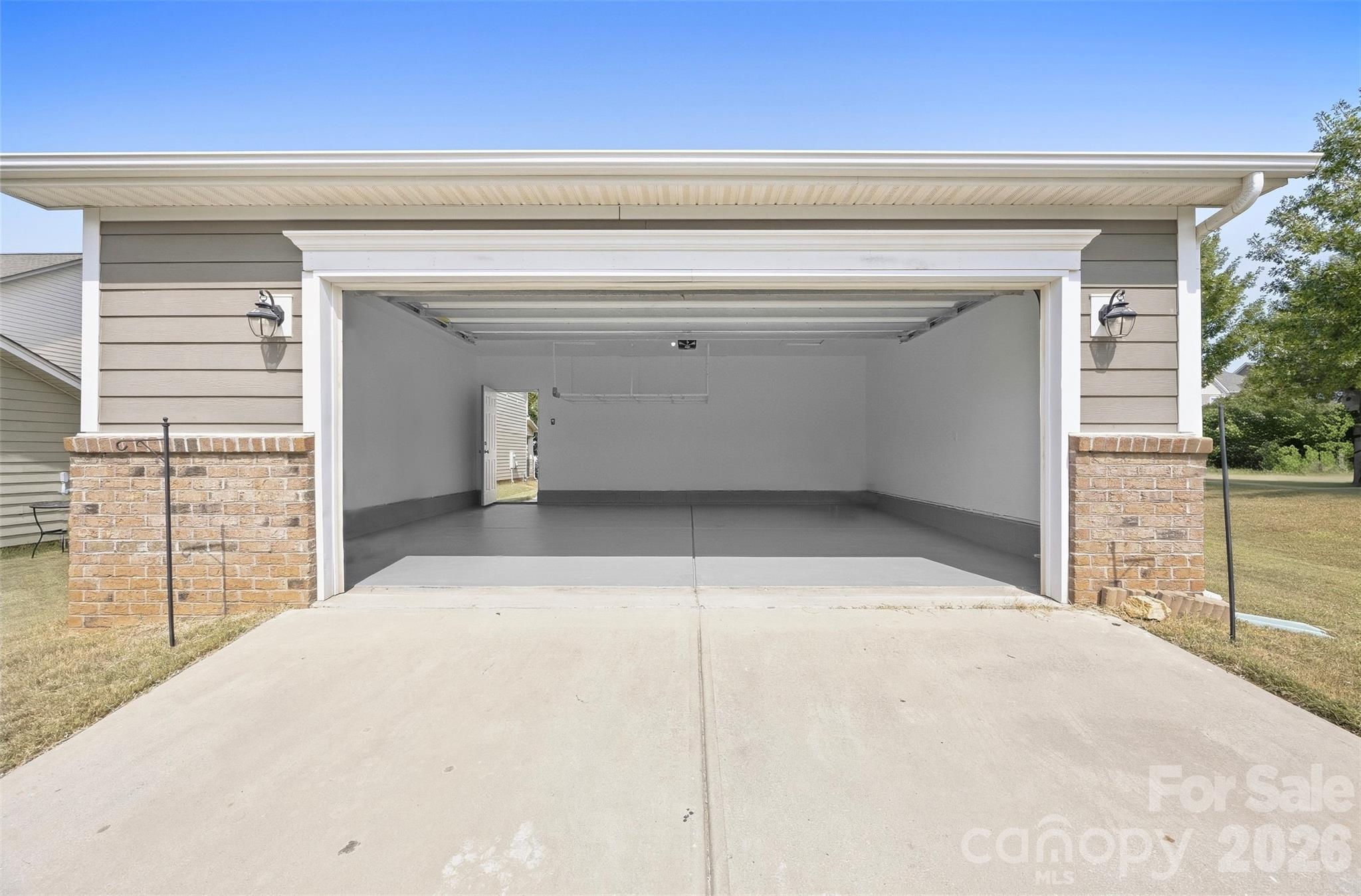 Detached two-car garage provides secure parking plus valuable additional storage space - 2015 Kensley Drive, Waxhaw