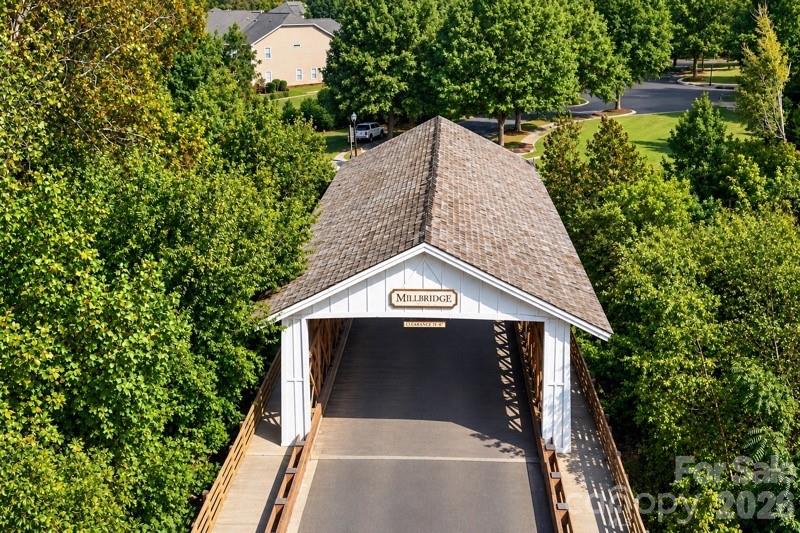 MillBridge’s iconic covered bridge over Twelve Mile Creek creates a memorable entrance and reflects the community’s distinctive small-town character - 2015 Kensley Drive, Waxhaw