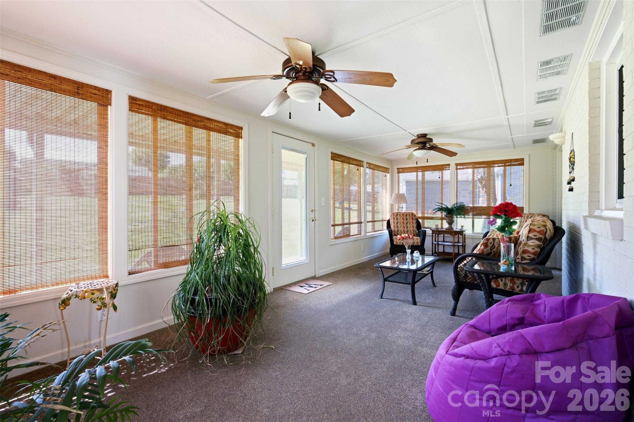 Beautiful sunroom with ceiling fans. - 118 Sherwood Drive, Taylorsville