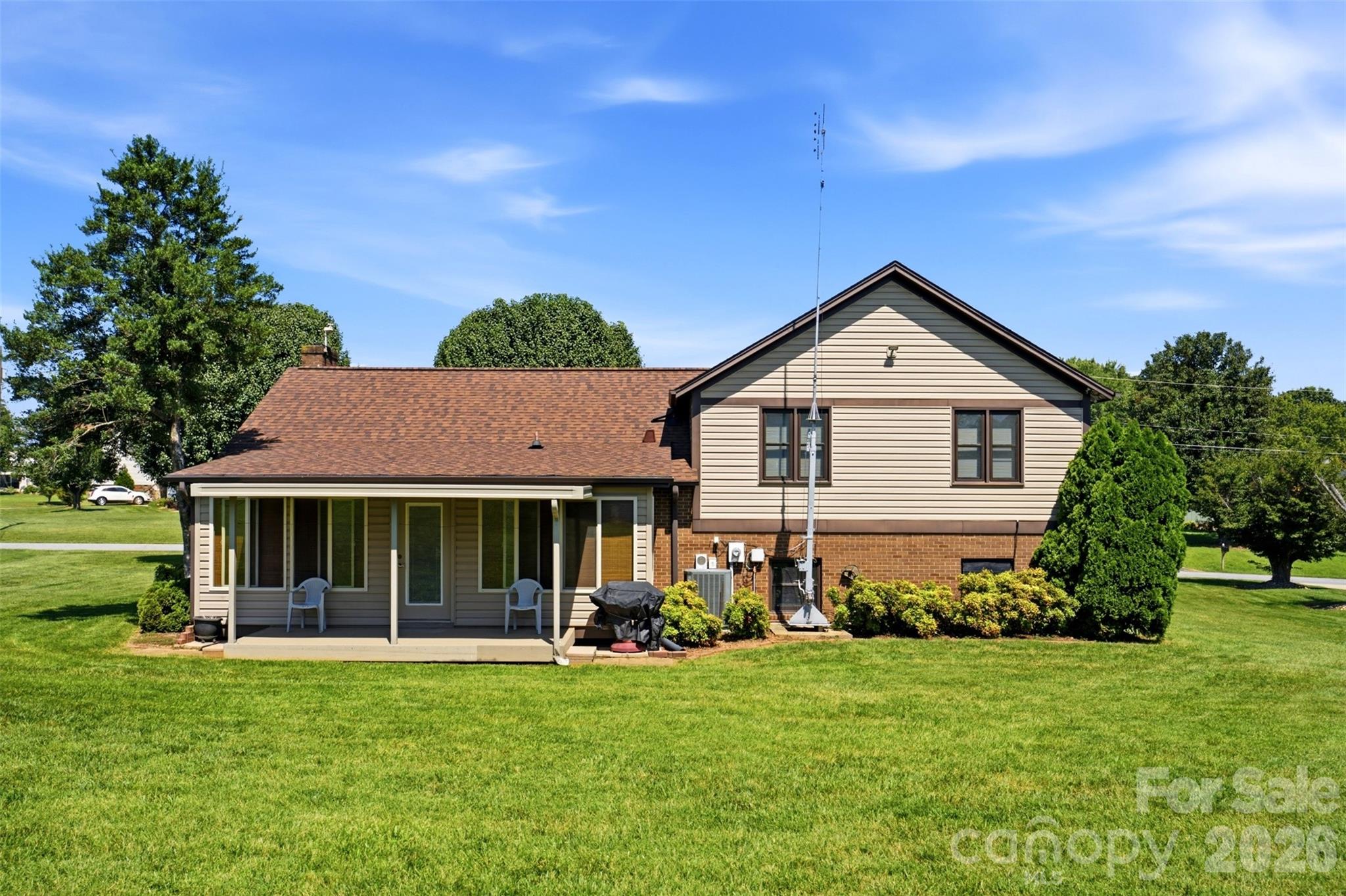 Covered porch off the sunroom. - 118 Sherwood Drive, Taylorsville