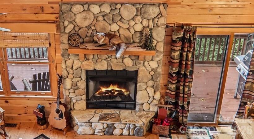 fireplace with stone - propane logs - 230 Forest Drive, Maggie Valley