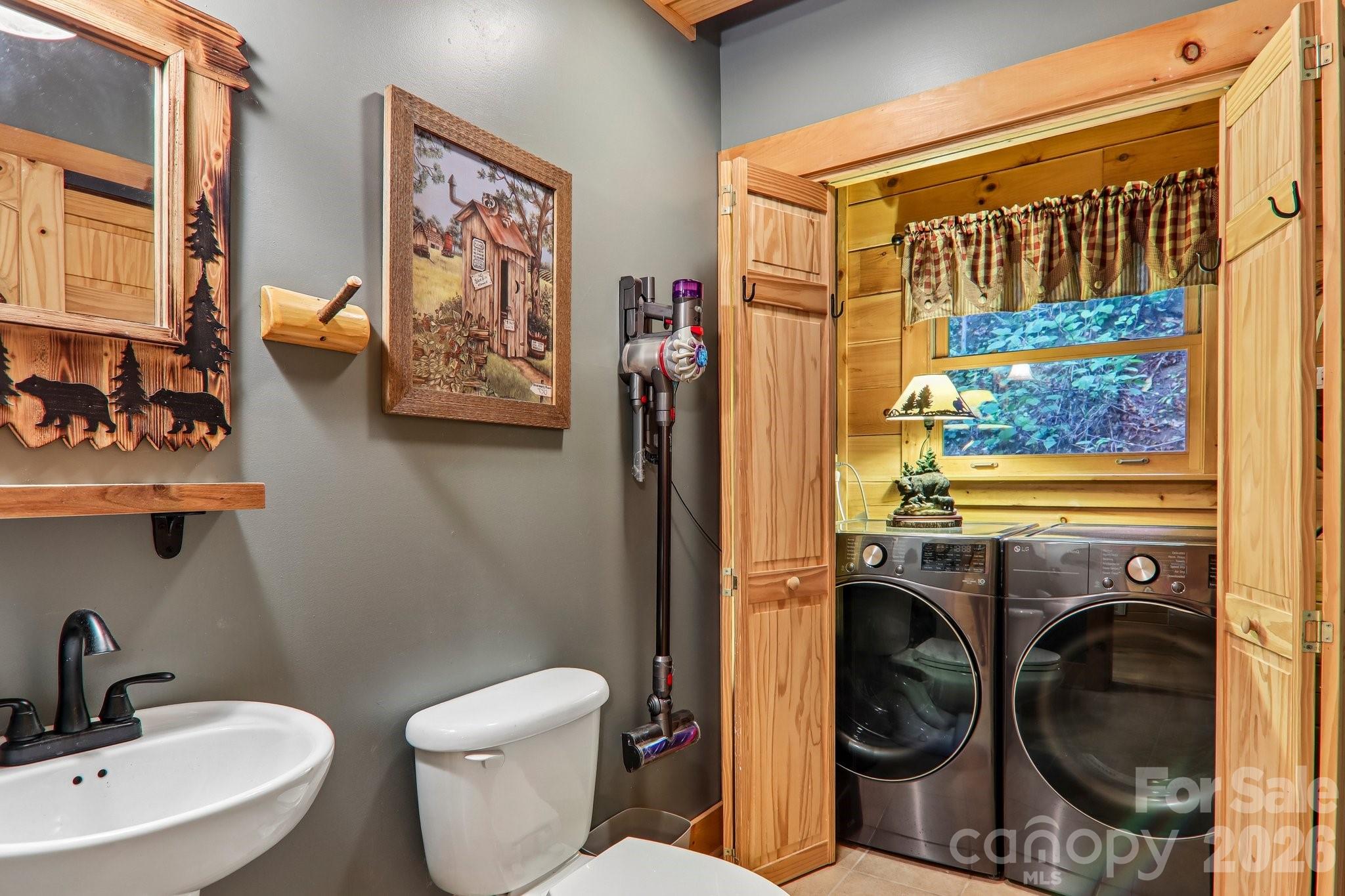 Powder room with laundry closet and storage - 230 Forest Drive, Maggie Valley