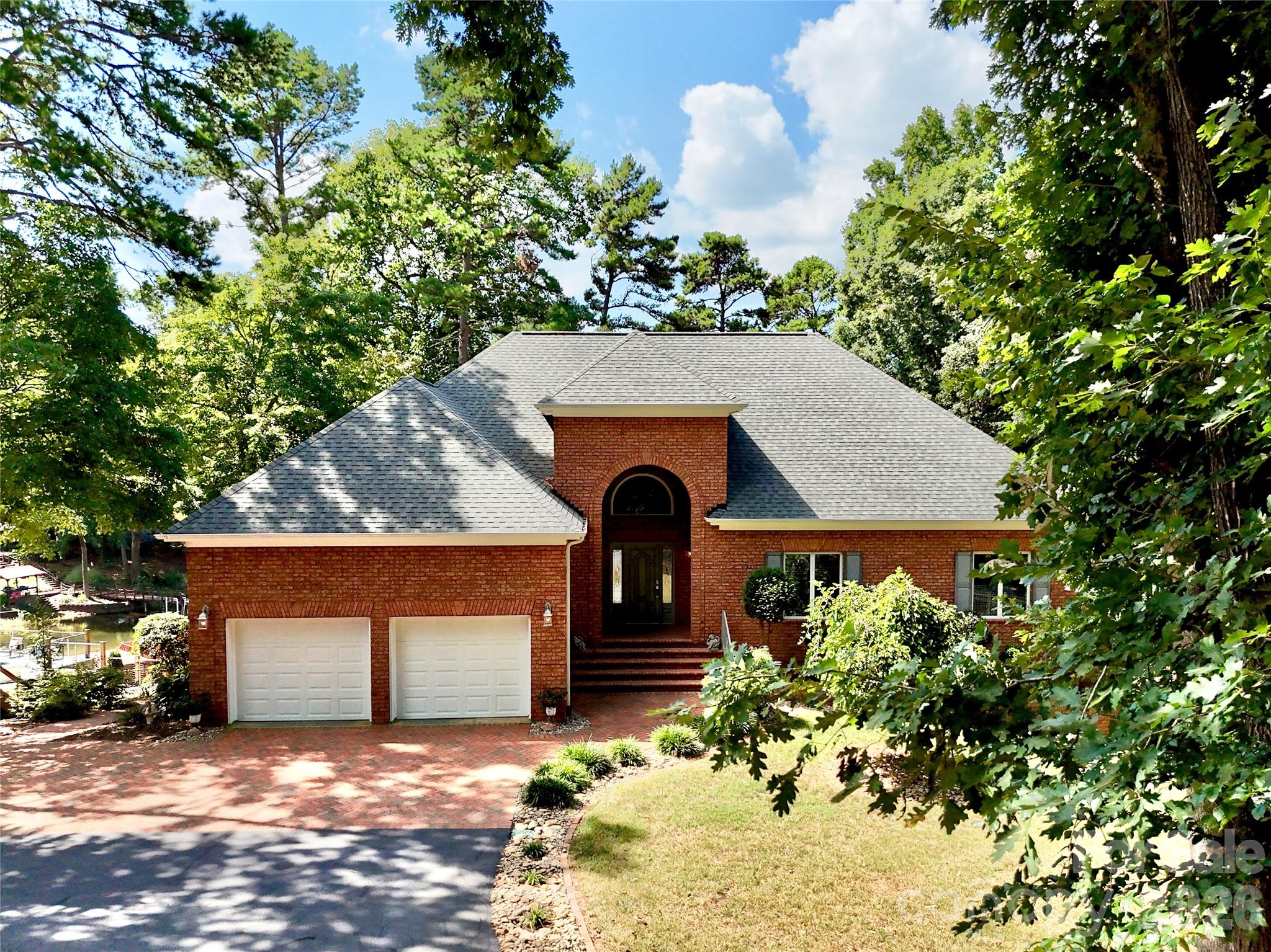 This 4 BR, 3 1/2 BA all brick home has new roof '24, new garage doors & driveway asphalt '26, new septic tank '25. - 140 Holt Lane, Mooresville
