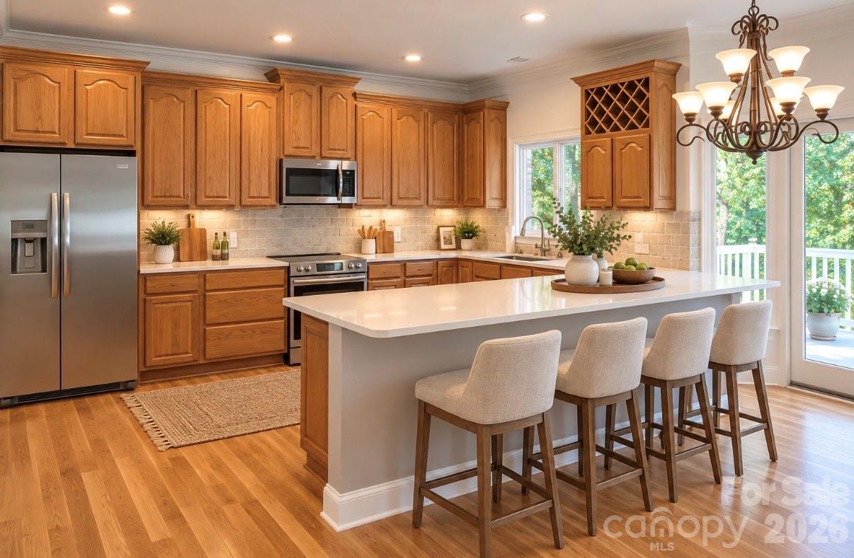 Virtually staged kitchen with breakfast bar. - 140 Holt Lane, Mooresville