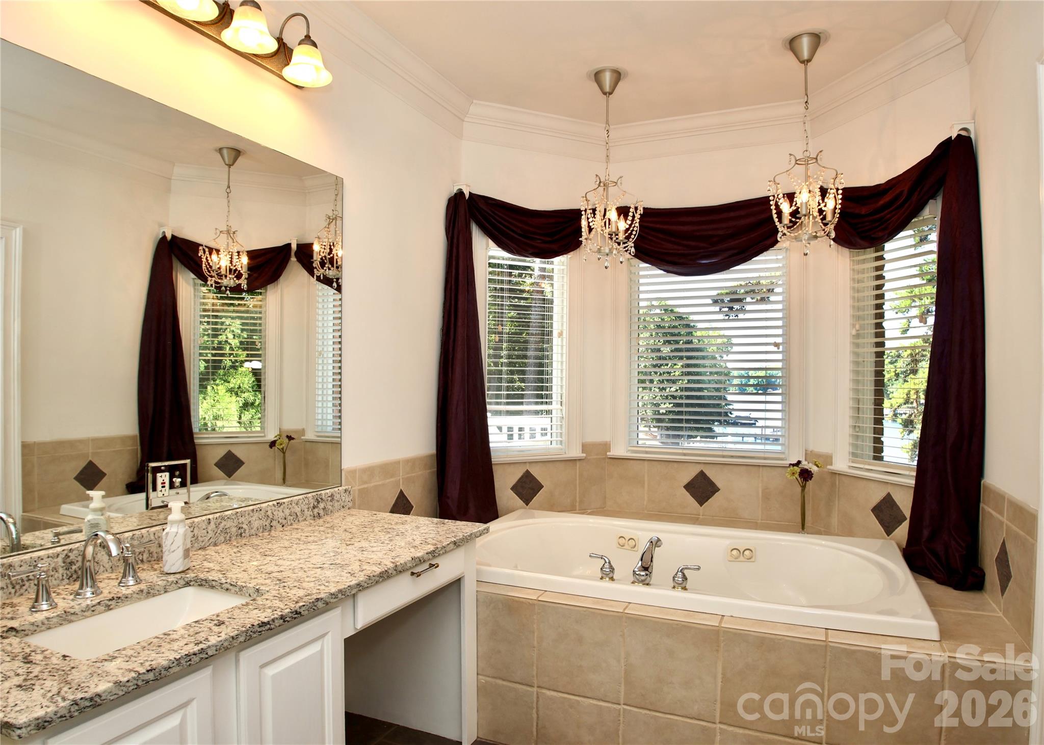Enjoy your whirlpool tub while also enjoying your waterfront view! Corner primary shower. - 140 Holt Lane, Mooresville