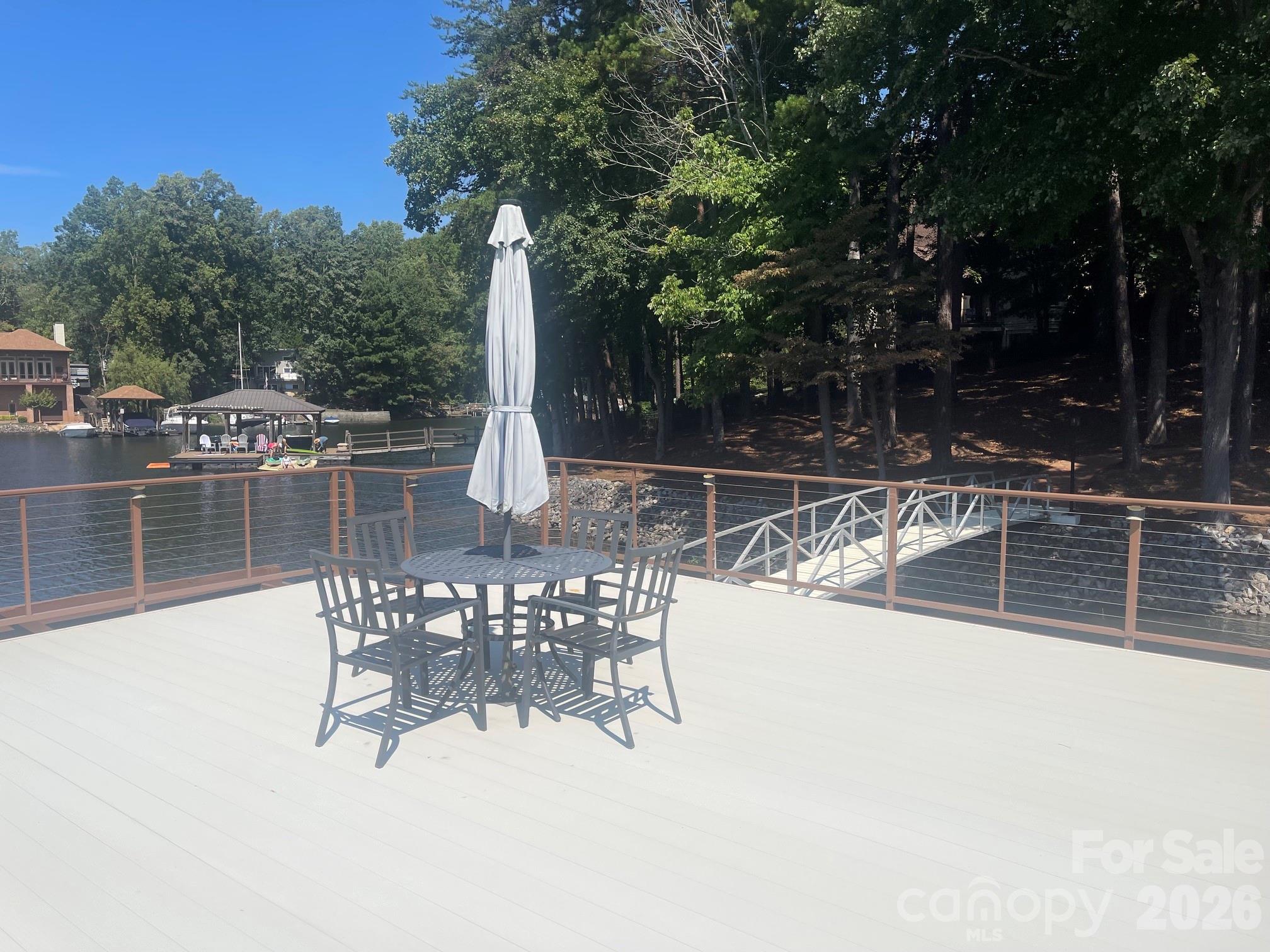 Enjoy your dance party on this big floating dock! Table, chairs, umbrella, and dock box included. - 140 Holt Lane, Mooresville