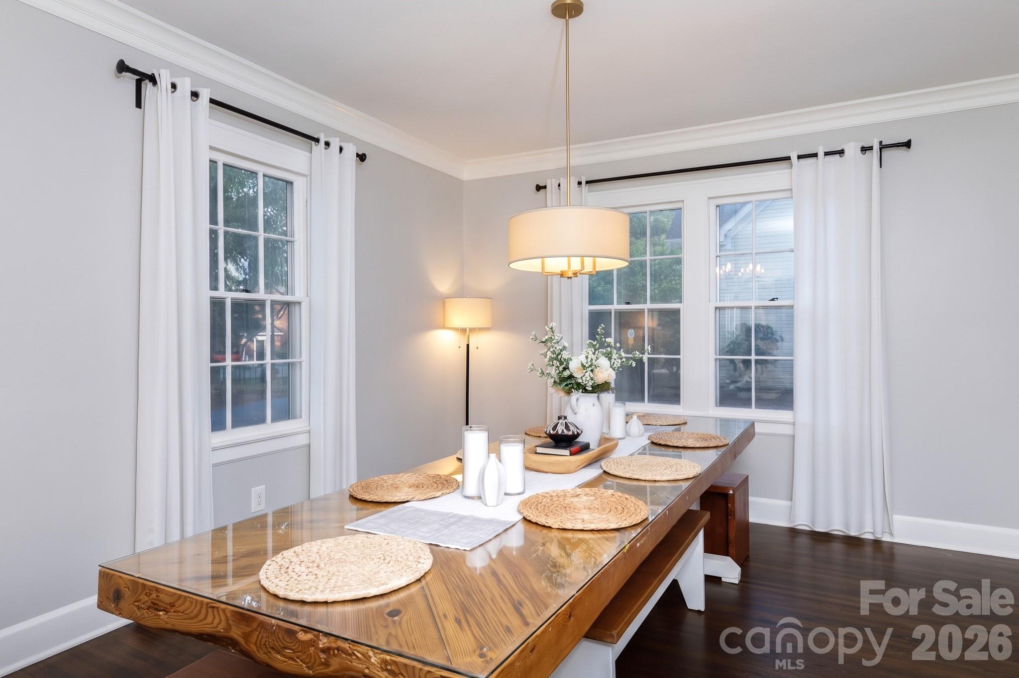 Dining room w/ lots of natural light, hardwoods and next to kitchen and front entrance...great flow for entertaining - 411 Dale Avenue, Gastonia