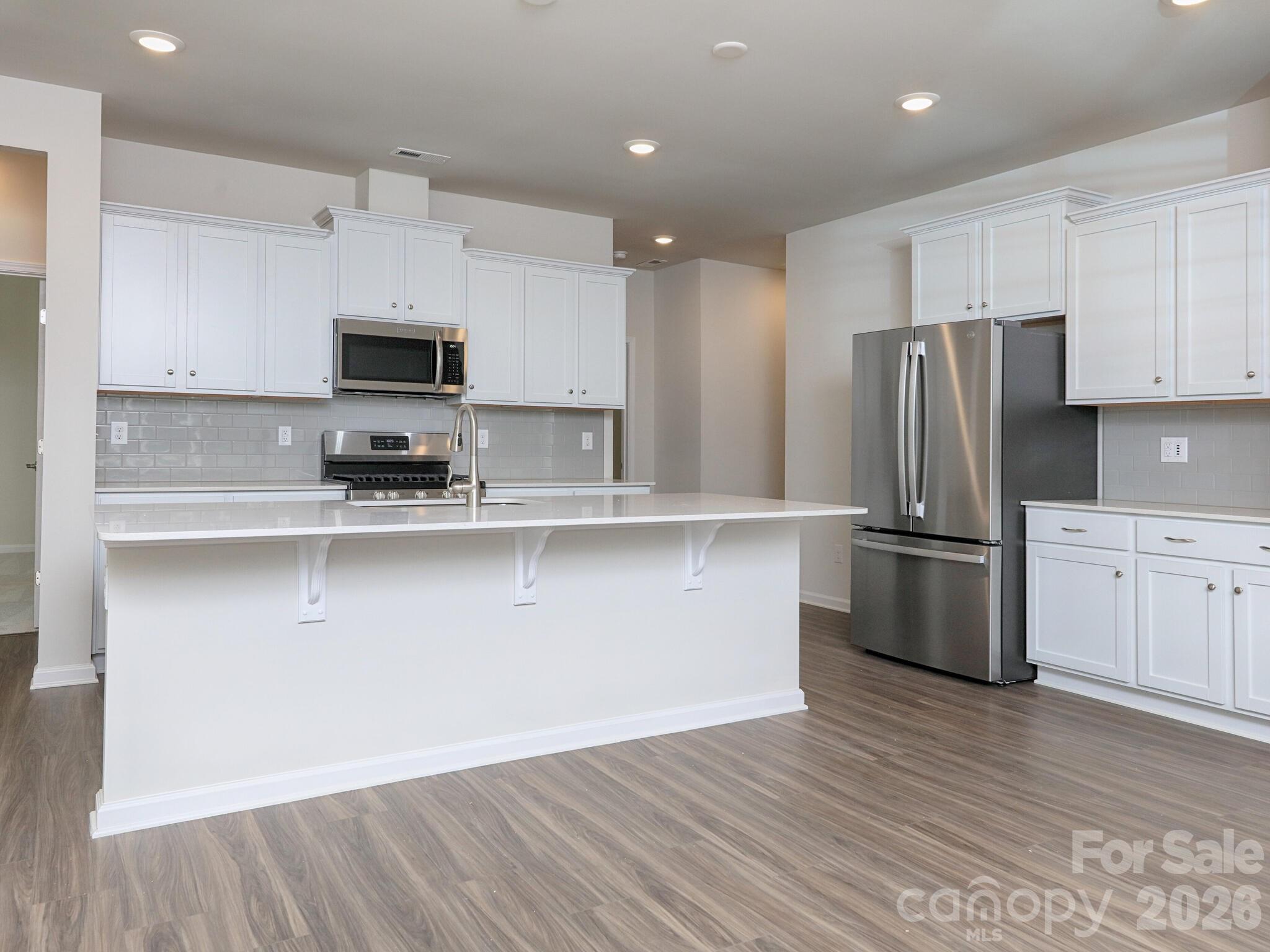 Beautiful kitchen has island with bar - 121 Olive Tea Lane, Statesville