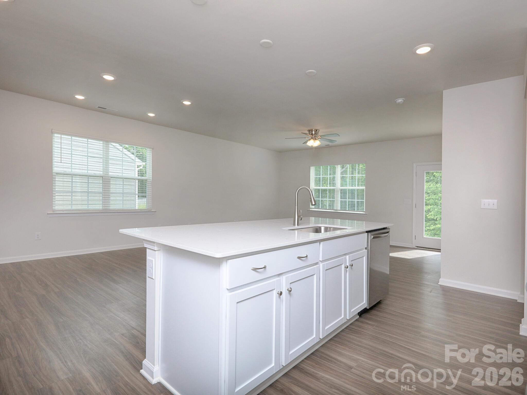 Island has farm style stainless sink - 121 Olive Tea Lane, Statesville