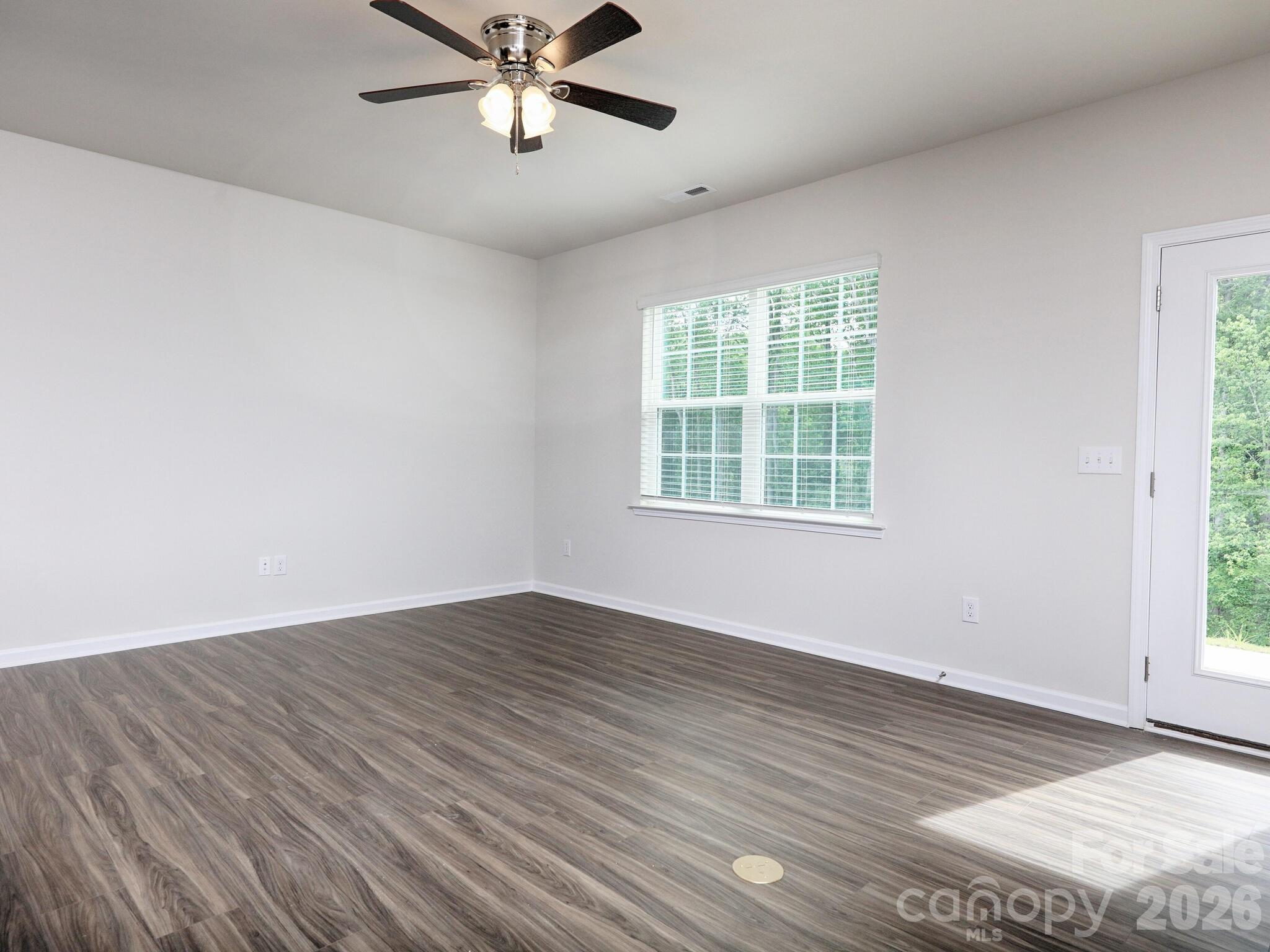 Vinyl plank floor throughout living area - 121 Olive Tea Lane, Statesville