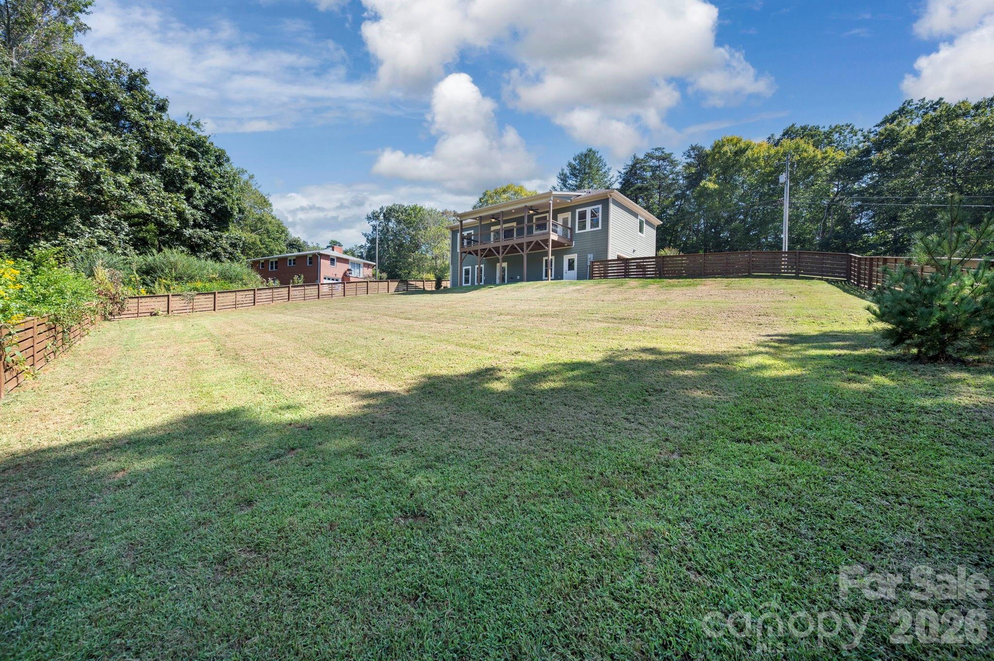 Large fully fenced gently sloping backyard - 139 Ridge Road, Candler