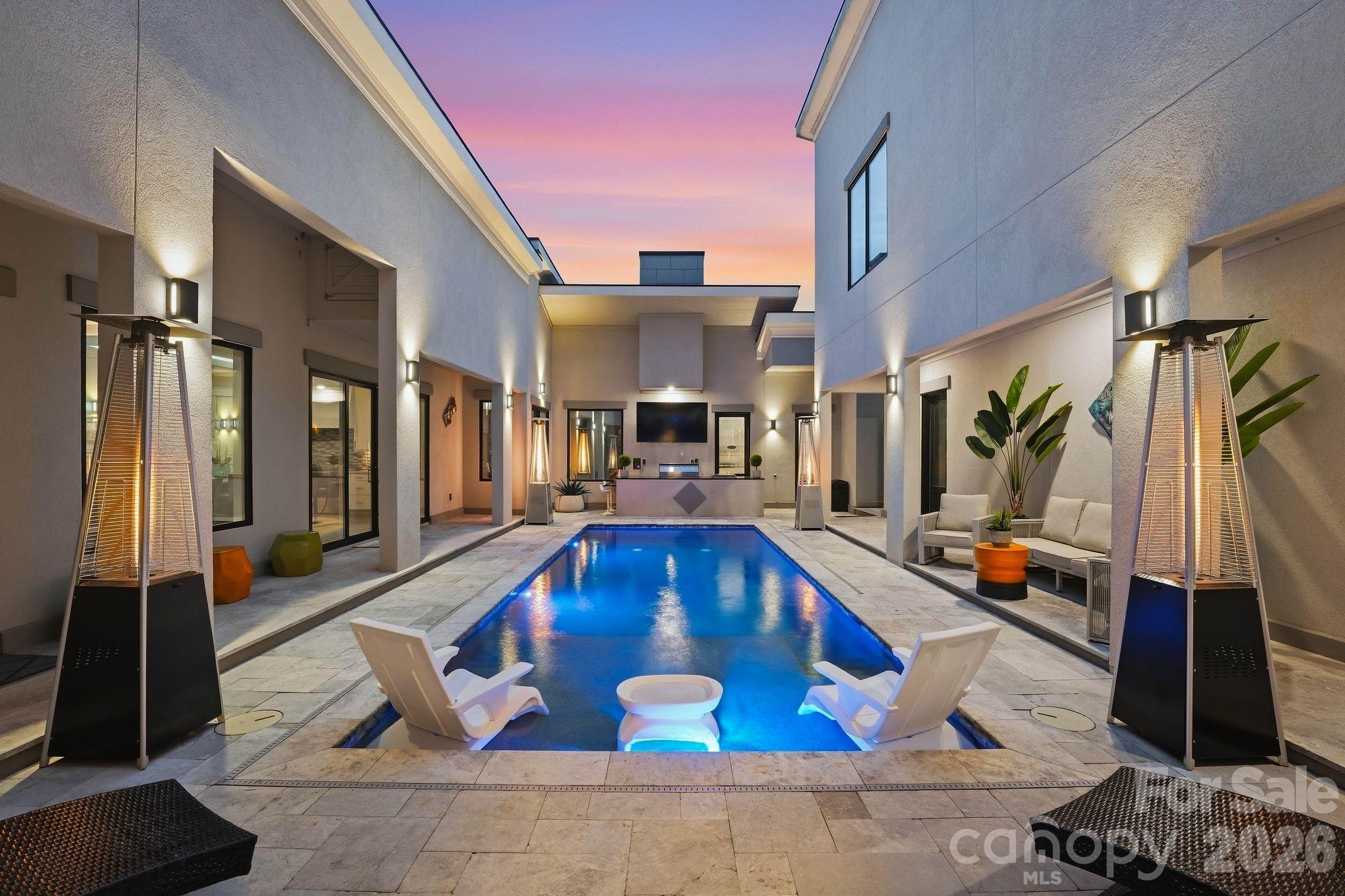 Private resort-style Courtyard featuringHeated saltwater pool - 15700 Youngblood Road, Charlotte