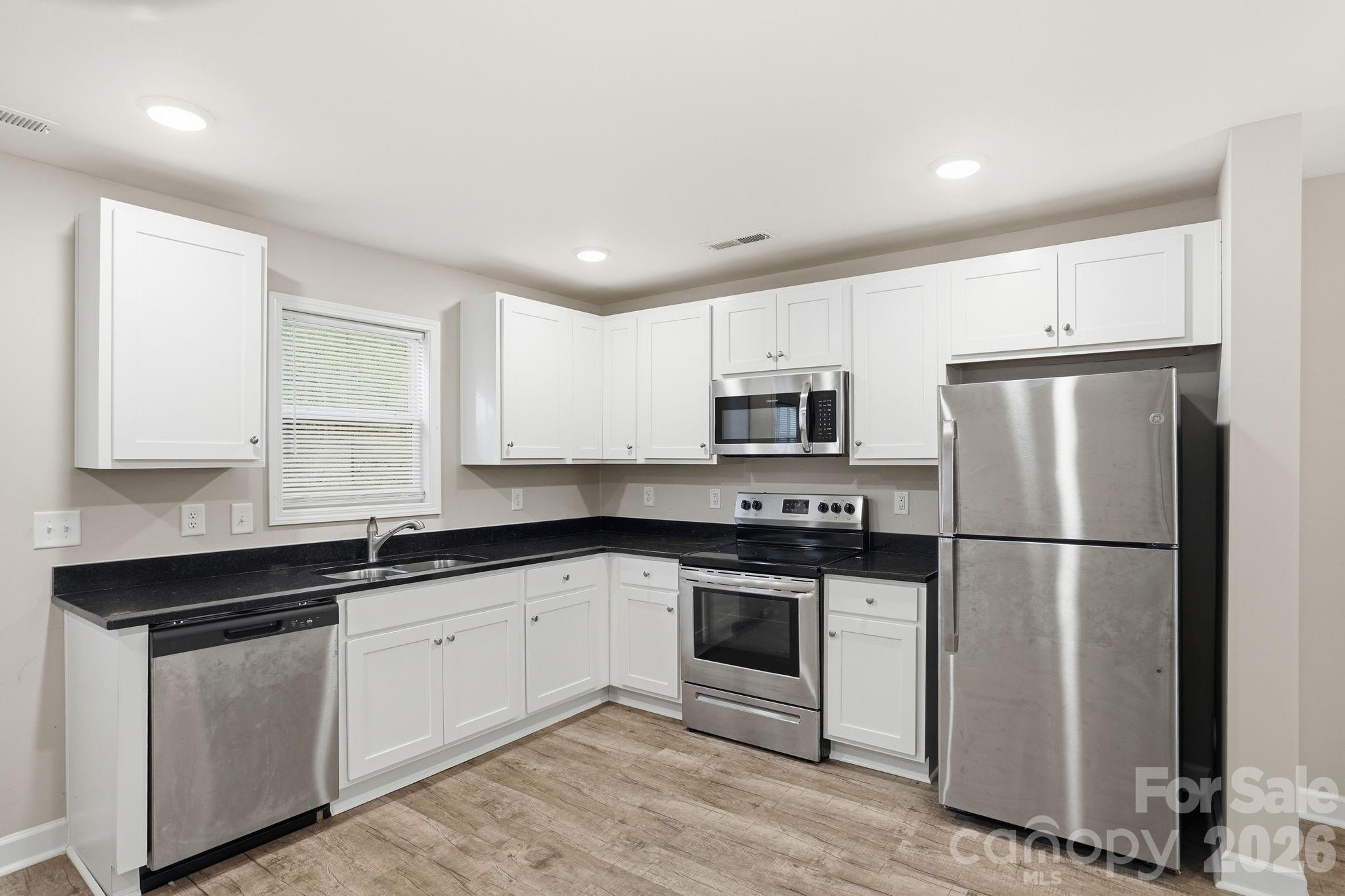 Townhouse at 153 Mckinnon Avenue NE, Concord, photo 9 of 36