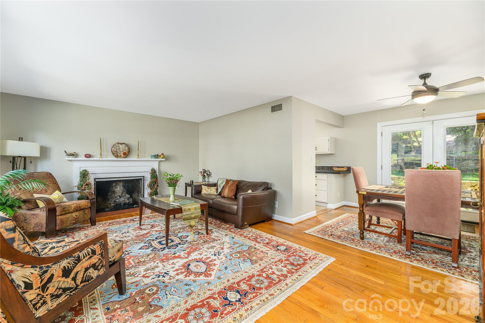 Living room into dining room and kitchen. - 111 Gracelyn Road, Asheville