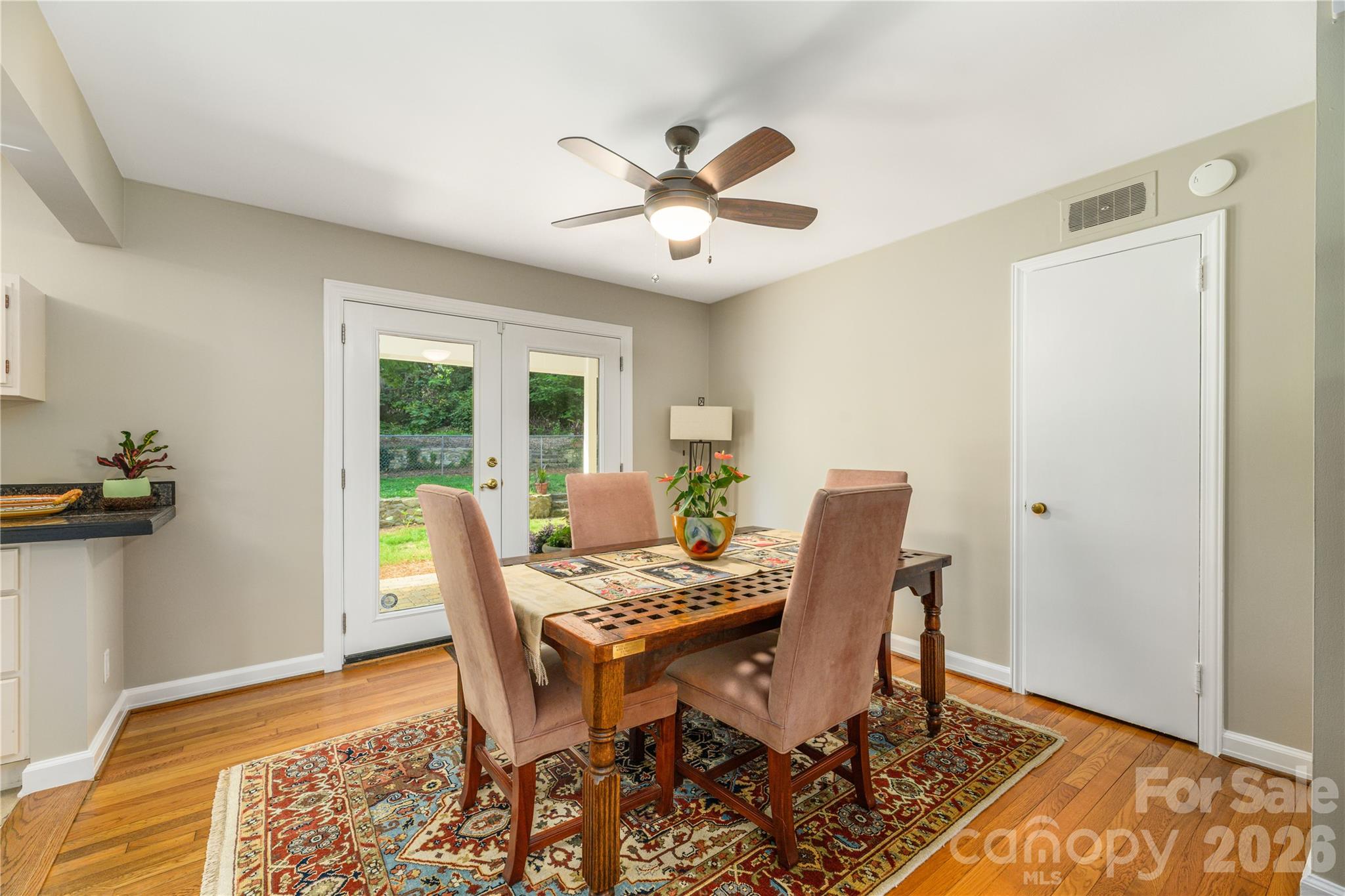 Dining area with French doors leading to lovely covered patio. - 111 Gracelyn Road, Asheville
