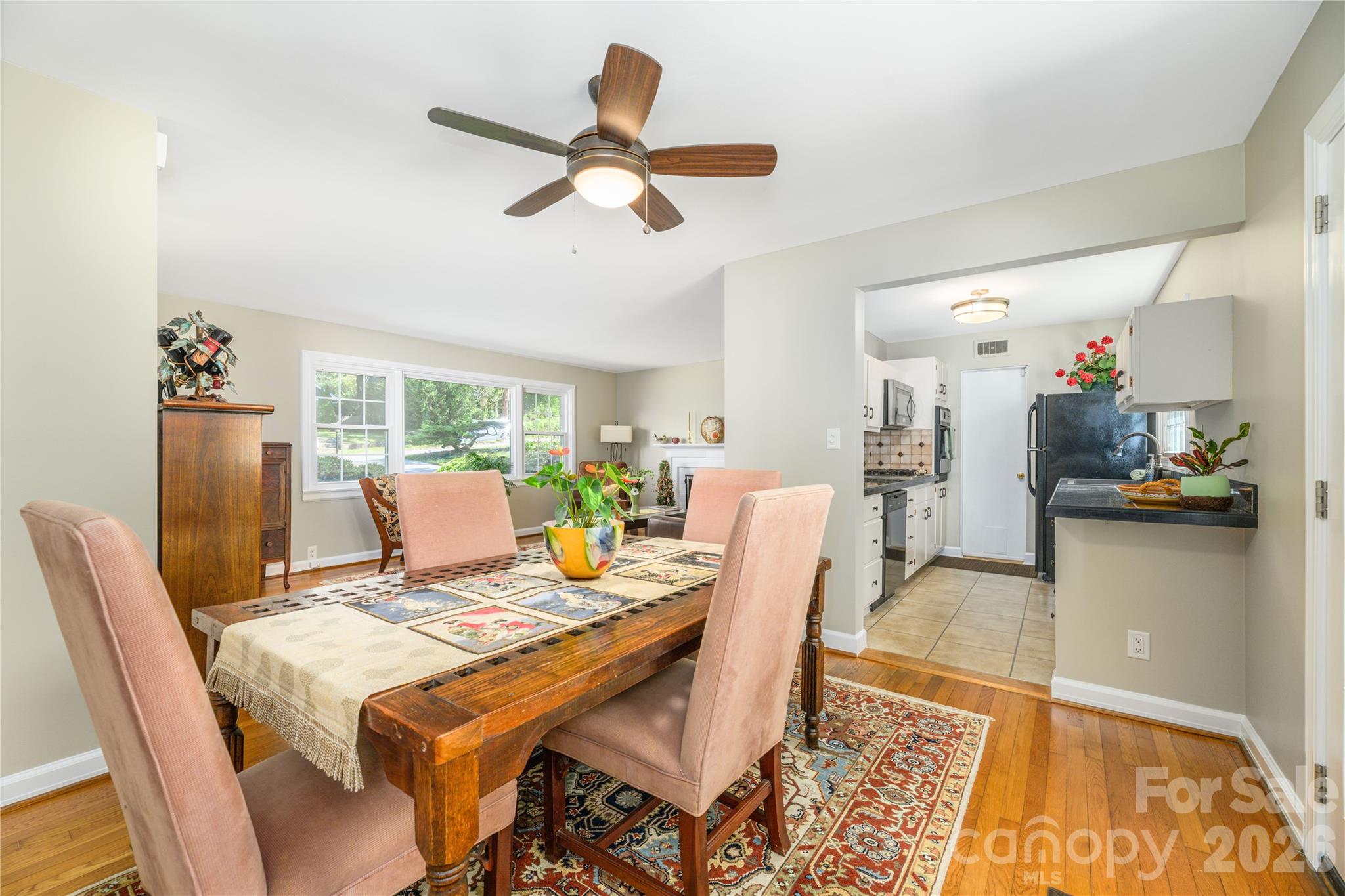Dining area looking into kitchen and living room. - 111 Gracelyn Road, Asheville