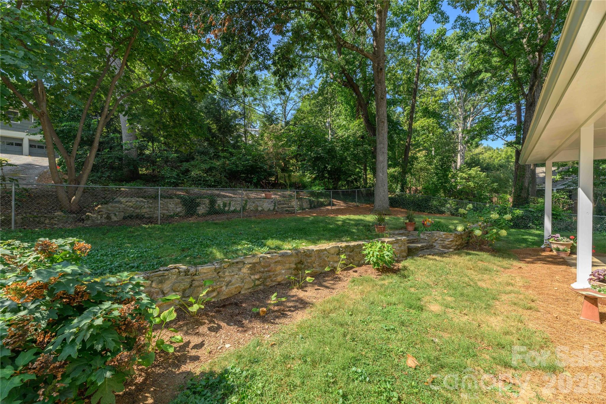 Lovely backyard with terraced stone walls. - 111 Gracelyn Road, Asheville