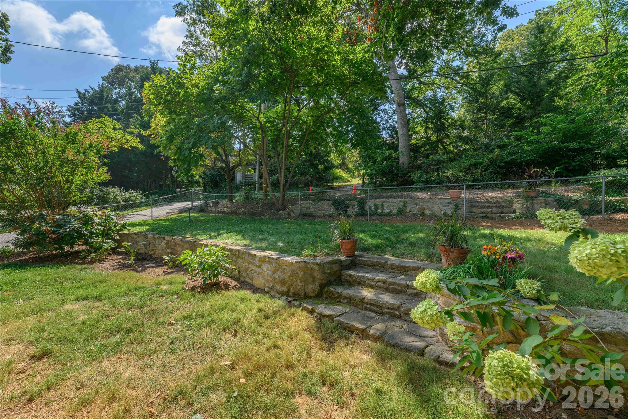 Rear yard and driveway entering from alley. - 111 Gracelyn Road, Asheville
