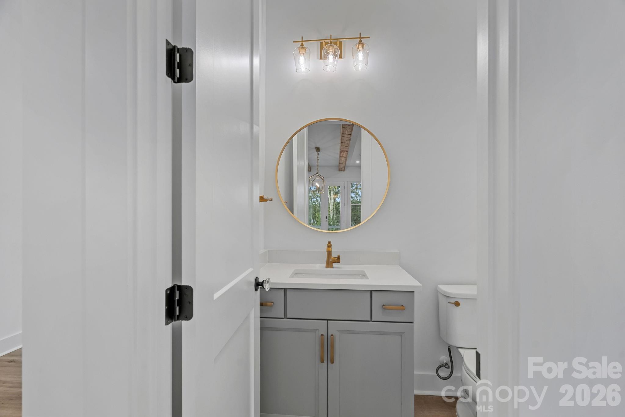 Main-level powder room, off the Kitchen/Great Room - 4477 Splash Trail, Sherrills Ford