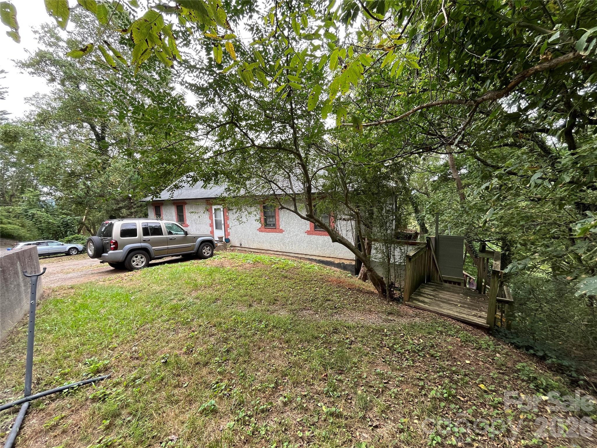 Right side yard and decking leading down to lower units - 332 S Beaumont Street, Asheville