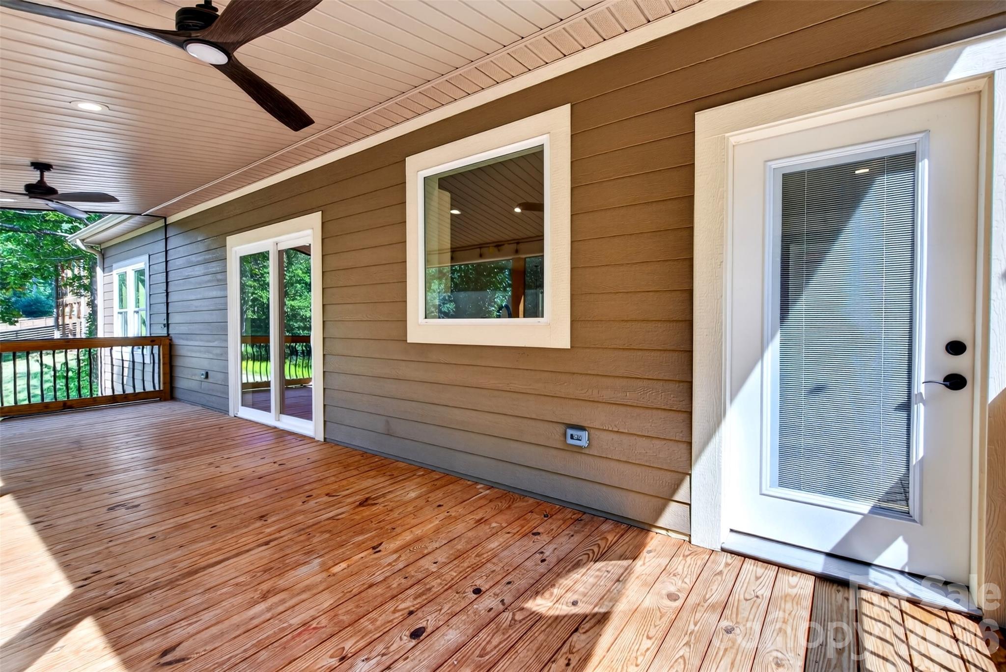enter covered porch from the living room OR primary bedroom - 131 Ridge Road, Candler