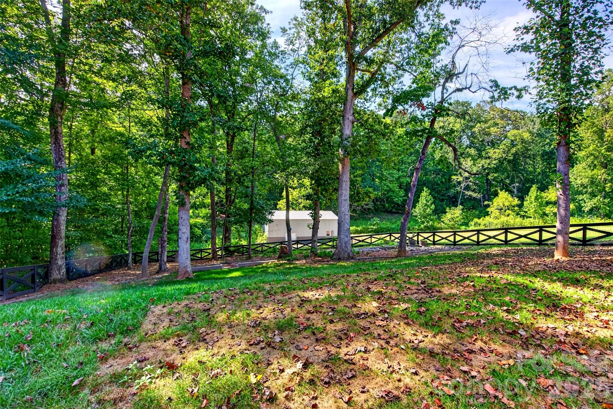 completely fenced-in backyard with firepit and gardens and mature trees - 131 Ridge Road, Candler