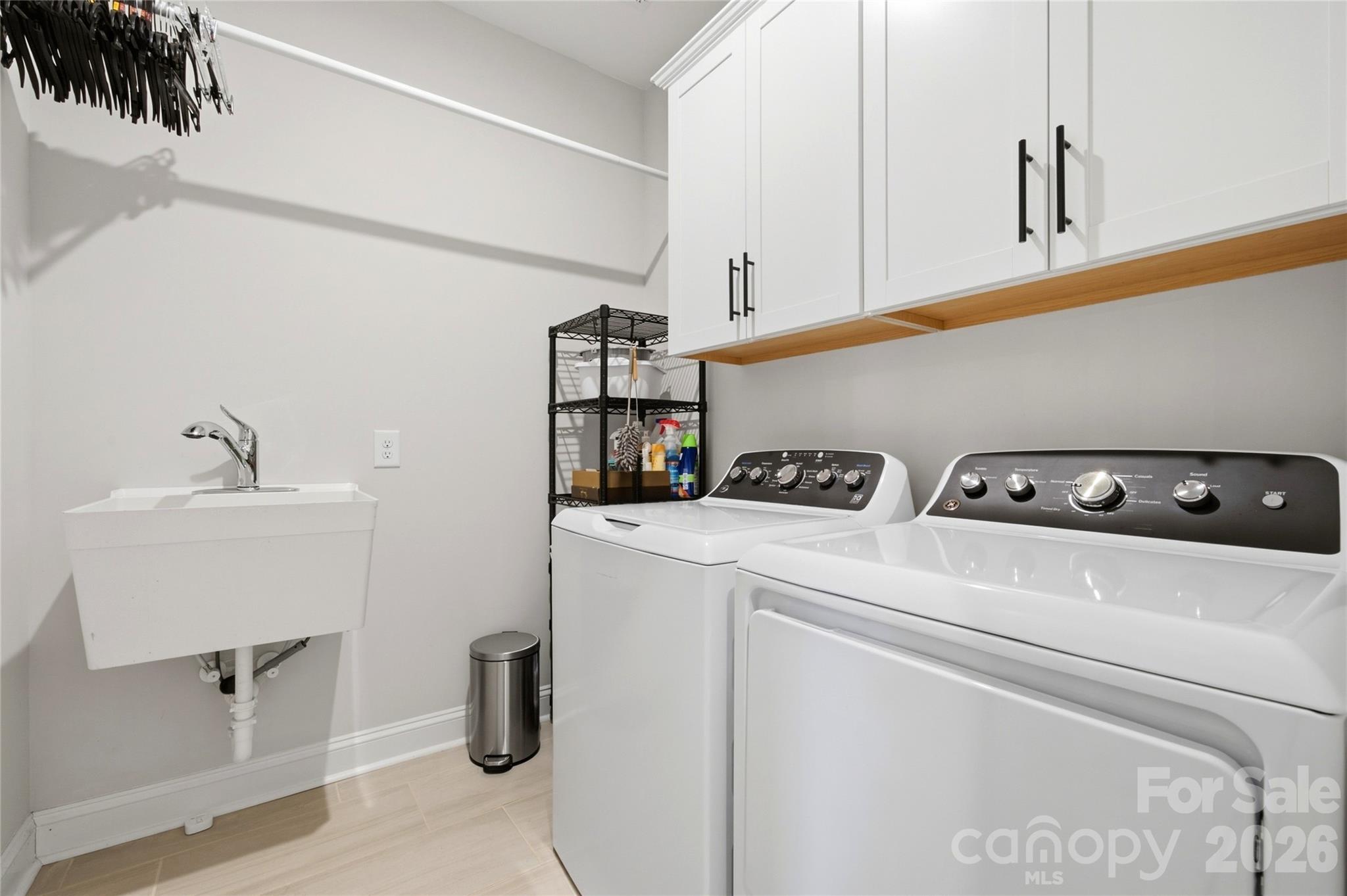 Laundry room with sink and cabinets - 1363 Regions Boulevard, Indian Land