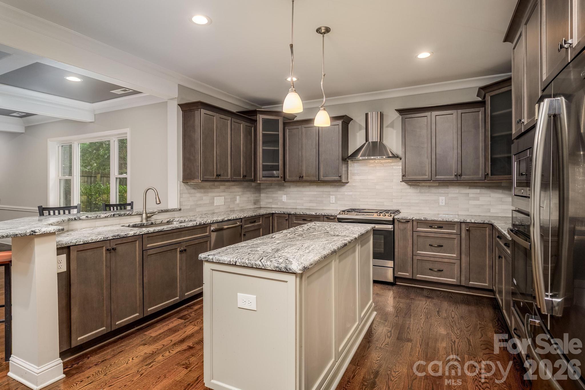 Beautiful kitchen, island, cabinetry, and finishes - 519 Union Street S, Concord