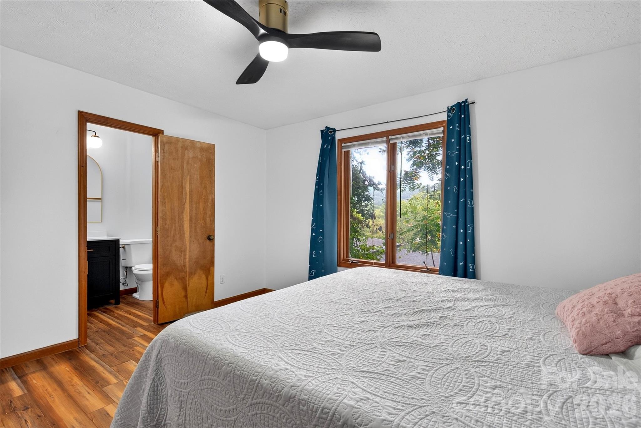 Primary bedroom has an updated en-suite bathroom - 39 Spooks Branch Extension, Asheville