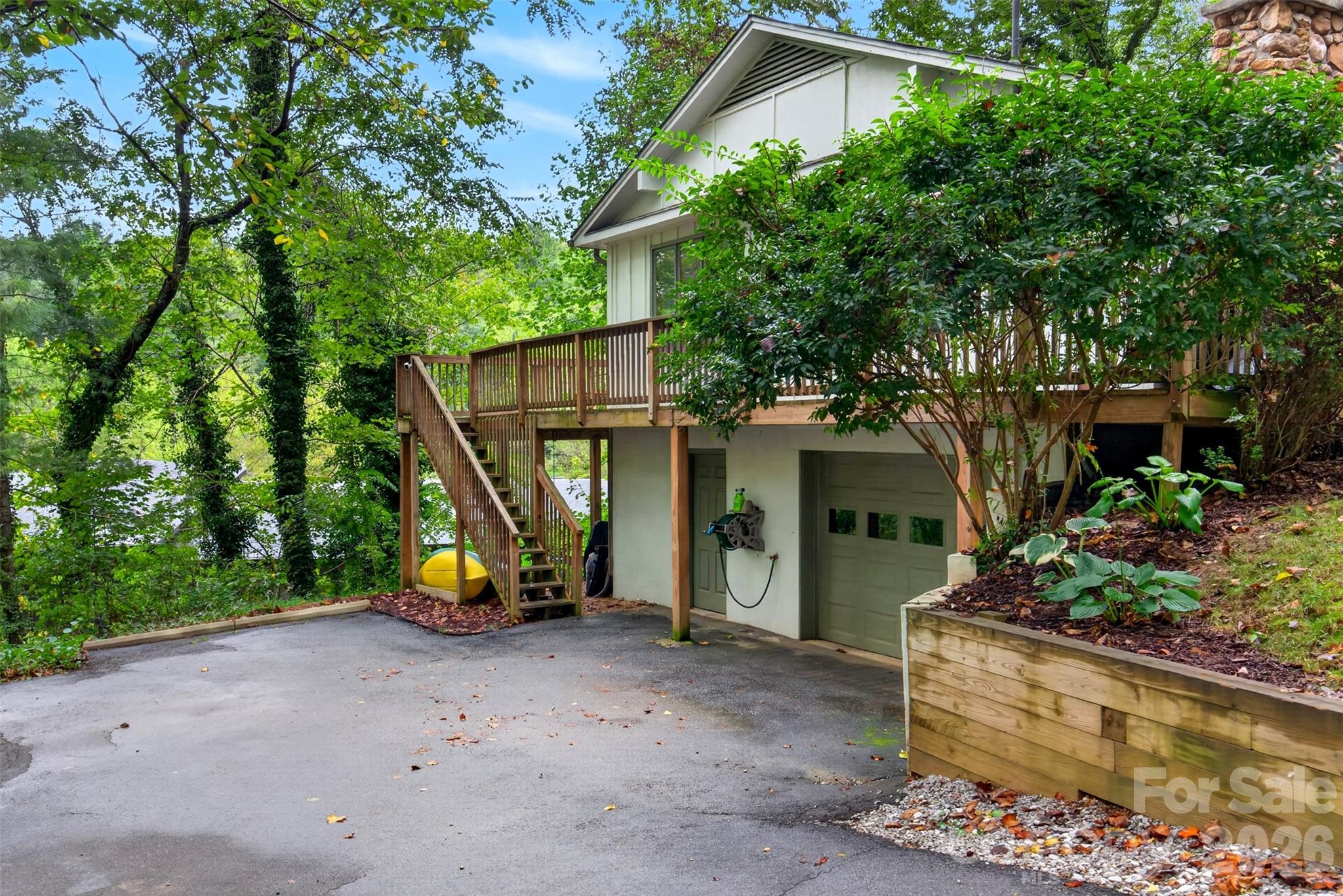 There is a one car attached garage with storage - 39 Spooks Branch Extension, Asheville
