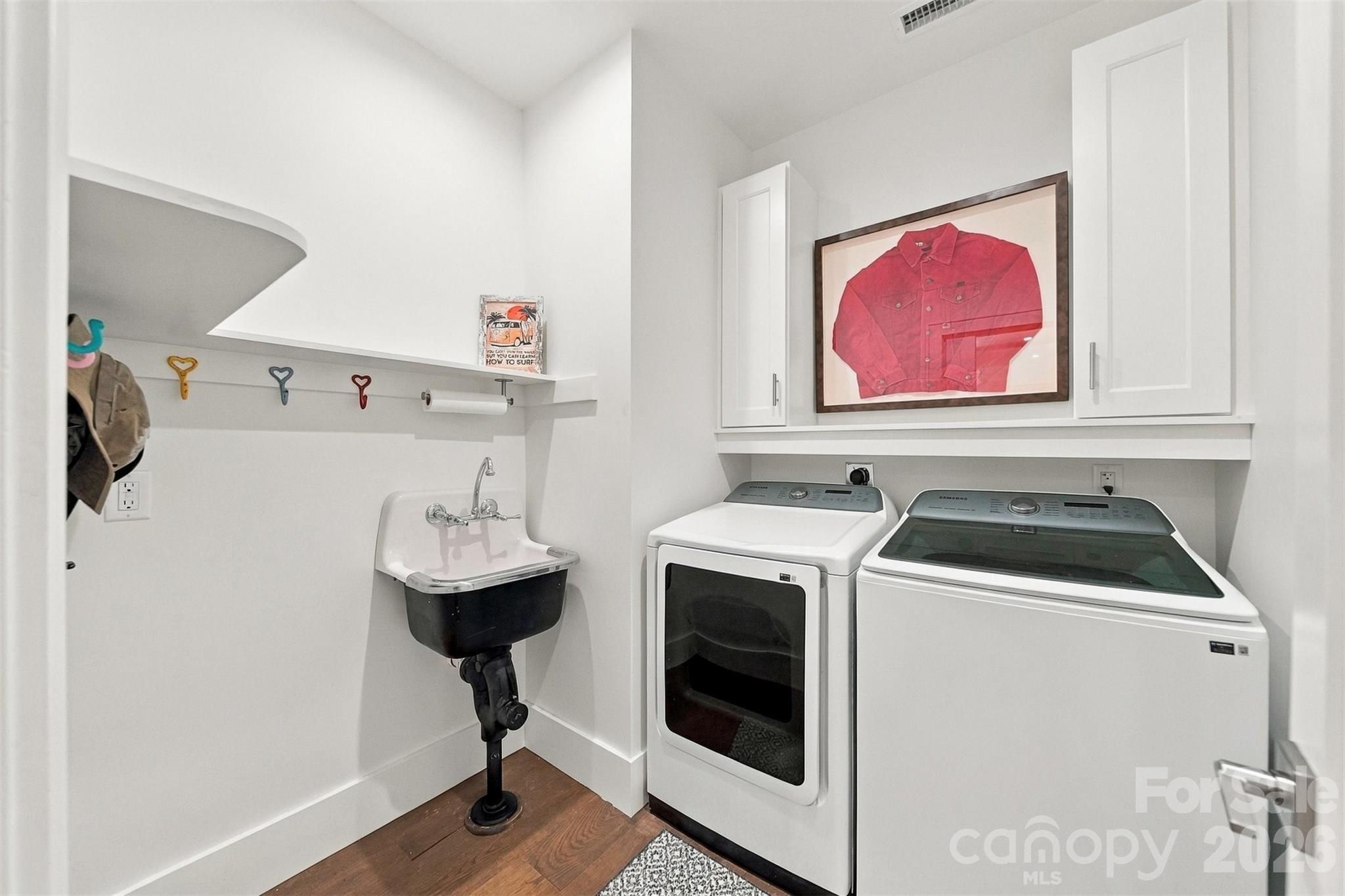 laundry room on main level - 217 Sycamore Drive, Nebo