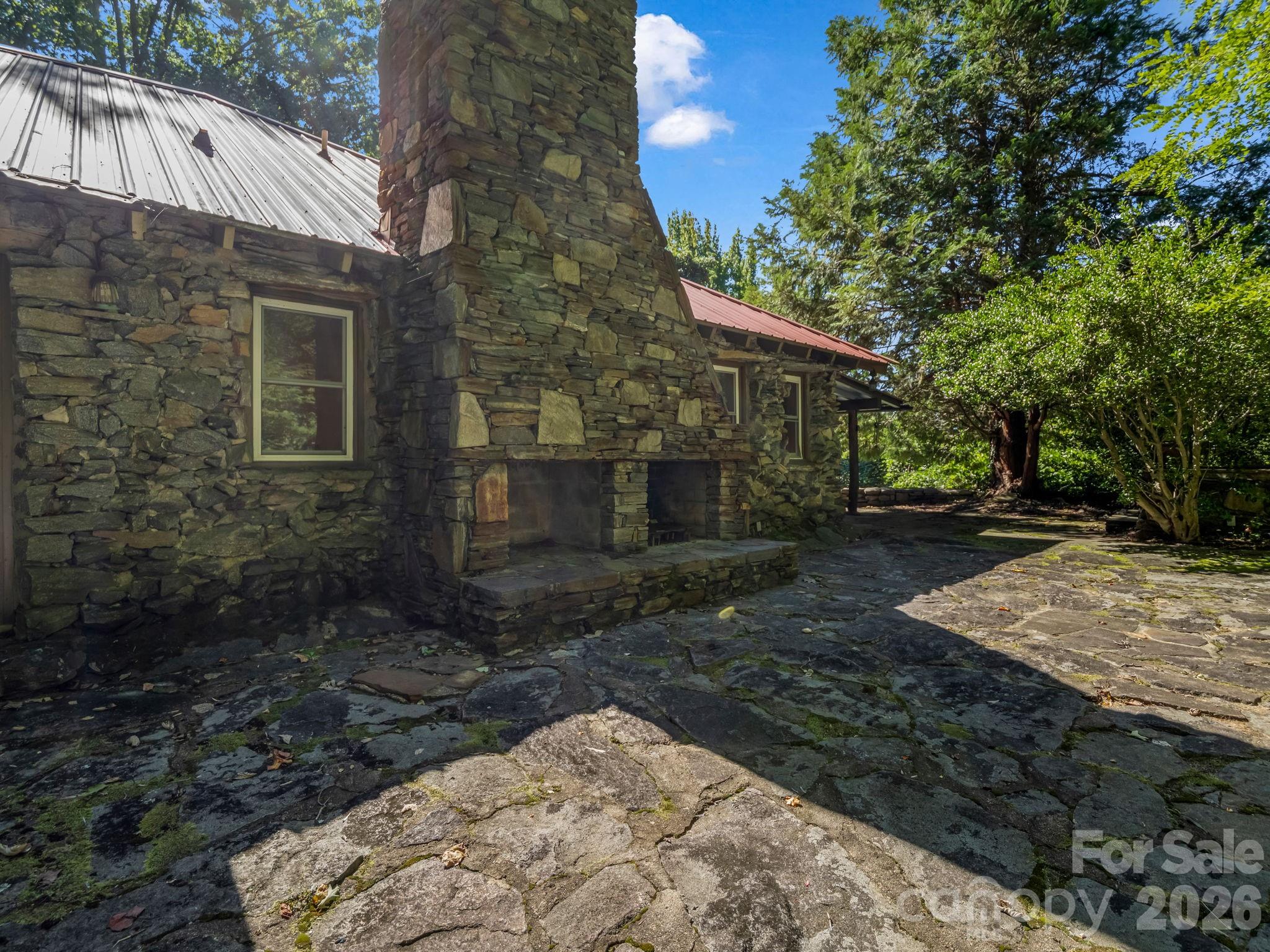 Exterior stone fireplace and patio - 145 Stone Hedge Lane, Tryon