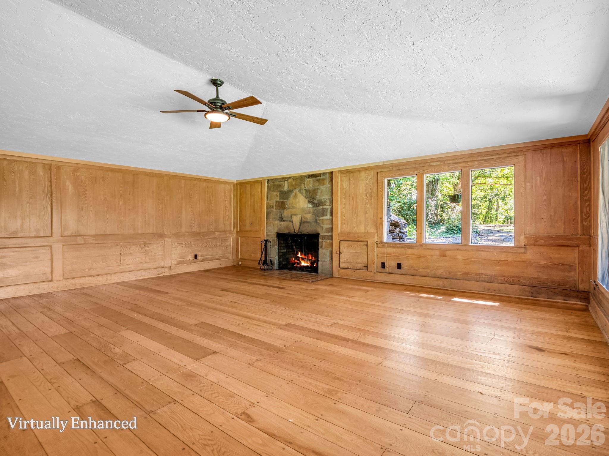 Living room with pickled chestnut walls - 145 Stone Hedge Lane, Tryon