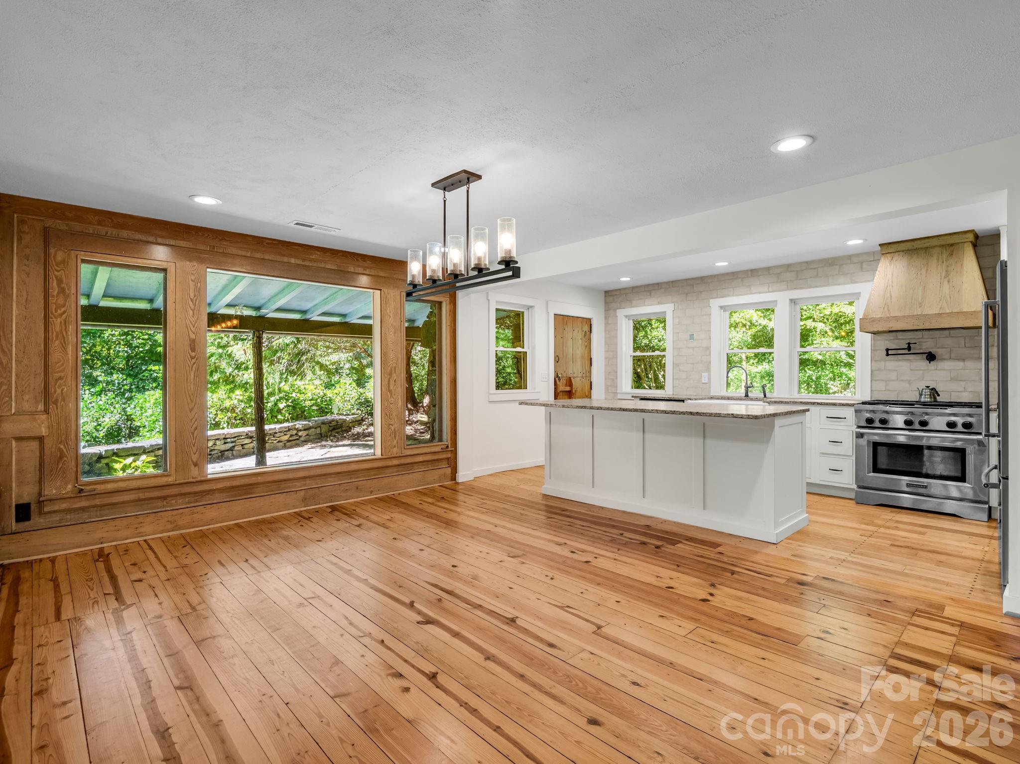 Open kitchen and dining area - 145 Stone Hedge Lane, Tryon