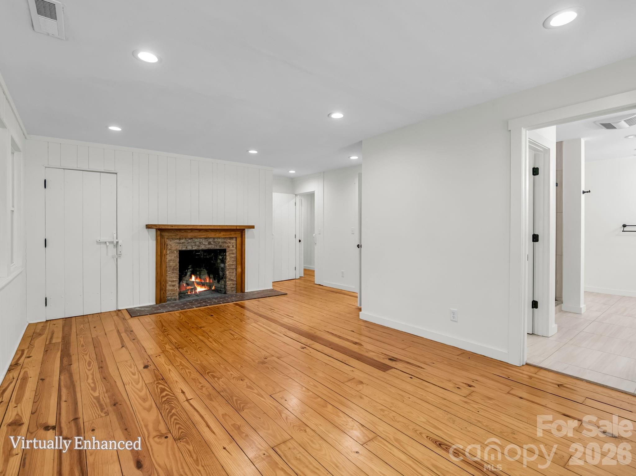 Primary bedroom with wood burning fireplace - 145 Stone Hedge Lane, Tryon