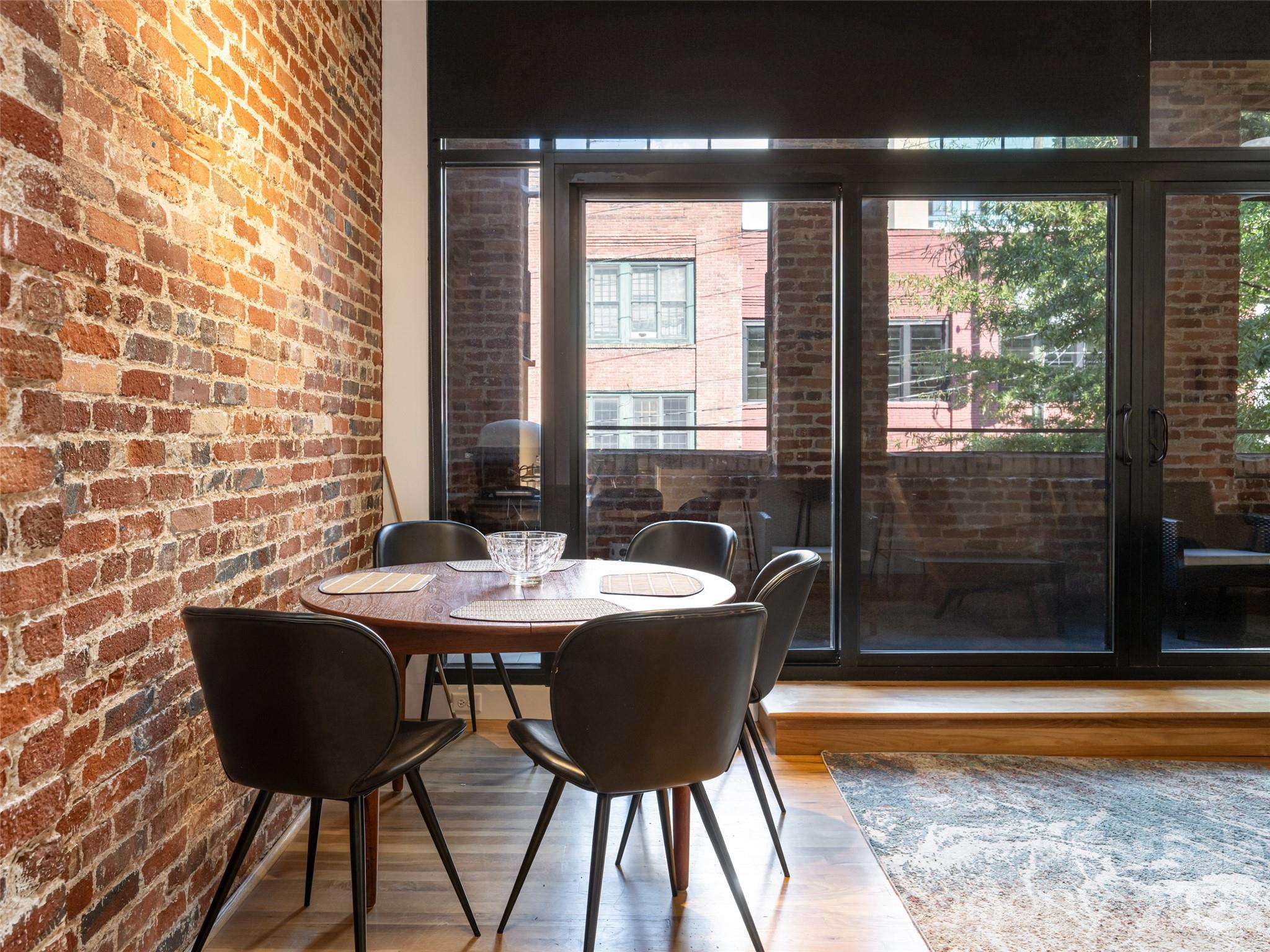 Exposed brick walls in the dining area - 15 Rankin Avenue, Asheville