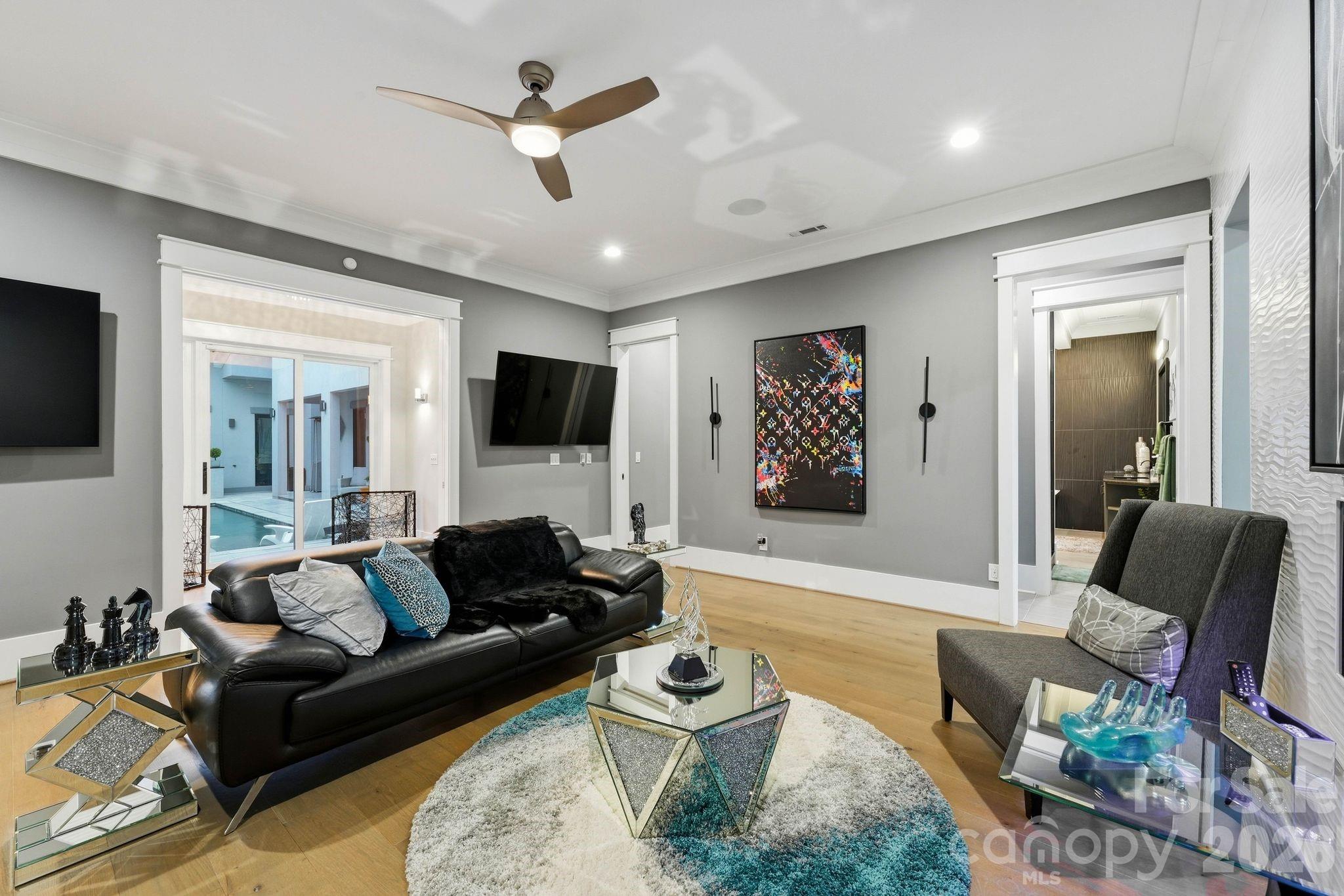 Master Bedroom Suite with Private One-Way Mirror Glass Overlooking the Private Quart Yard Pool and Terrace - 15700 Youngblood Road, Charlotte