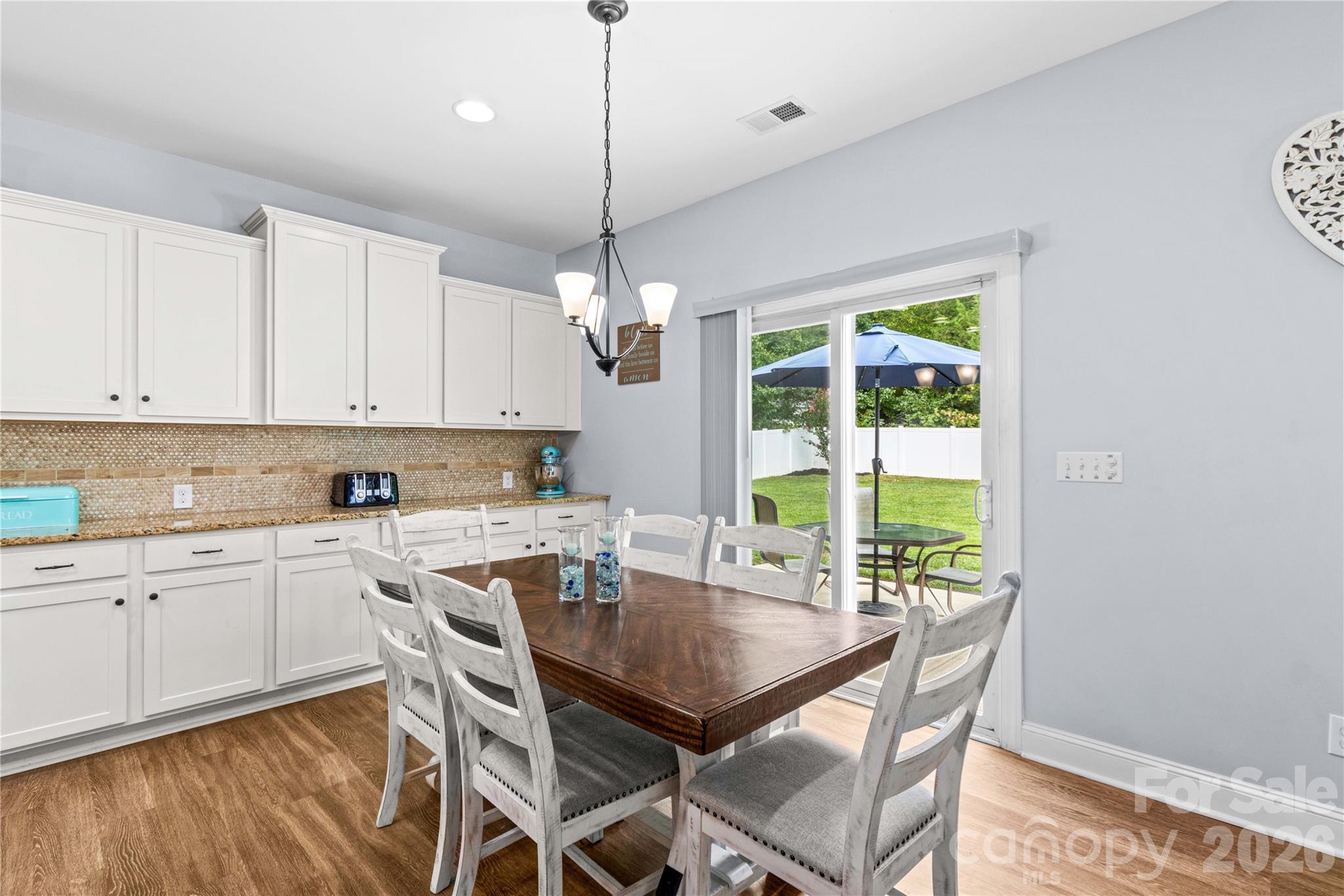 Dining overlooks Back Yard - 111 Paradise Hills Circle, Mooresville