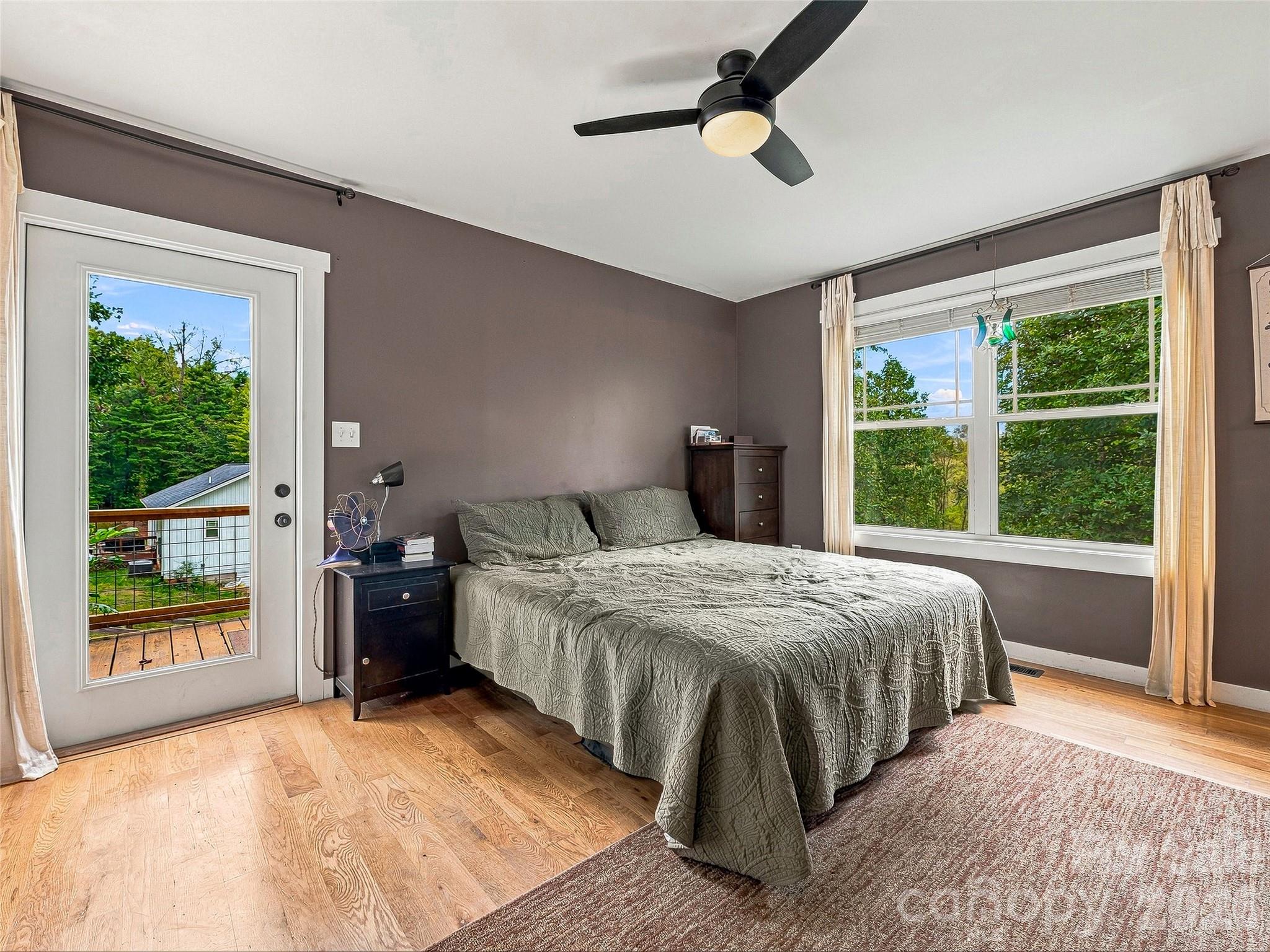 Primary bedroom with access to private deck with mountain views - 1884 Bear Creek Road, Leicester