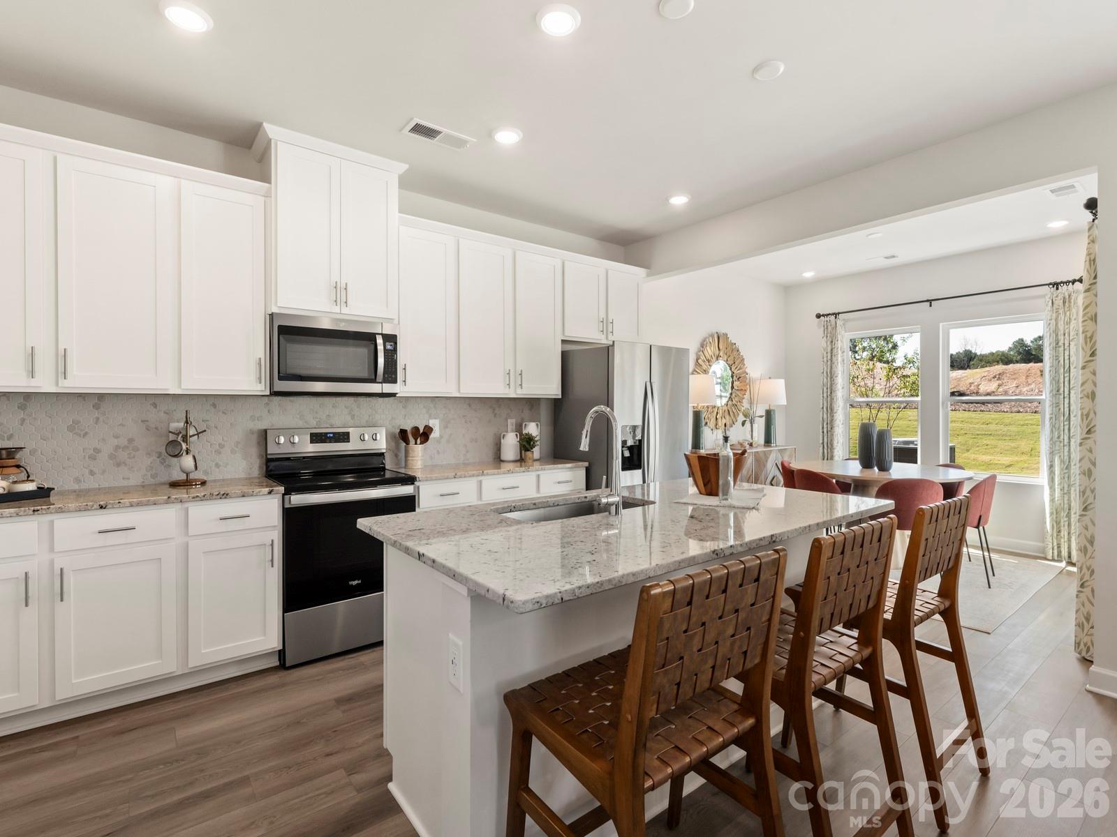 Photo is not of the actual home, but is an inspirational photo of builder’s model home and may depict options, furnishings, and/or decorator features that are not included - 12644 Russellwood Lane, Charlotte