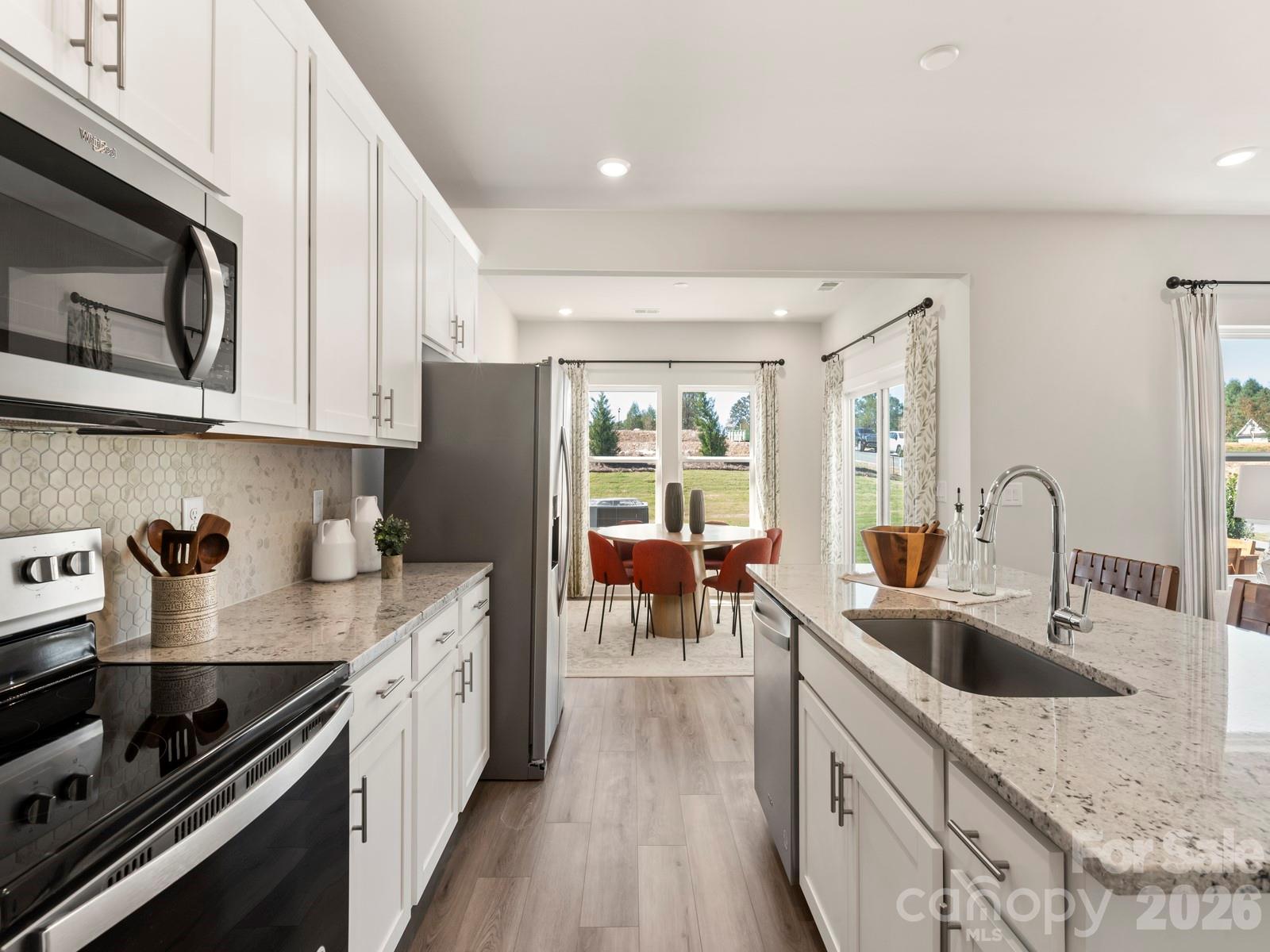 Photo is not of the actual home, but is an inspirational photo of builder’s model home and may depict options, furnishings, and/or decorator features that are not included - 12644 Russellwood Lane, Charlotte