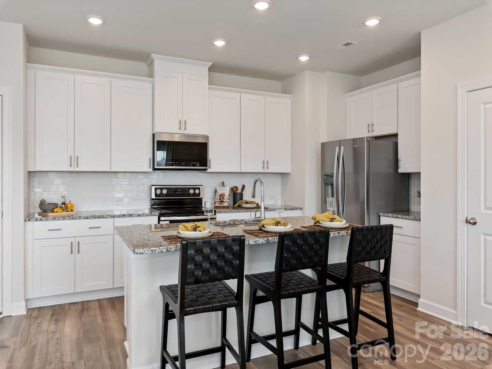 Photo is not of the actual home, but is an inspirational photo of builder’s model home and may depict options, furnishings, and/or decorator features that are not included - 12636 Russellwood Lane, Charlotte
