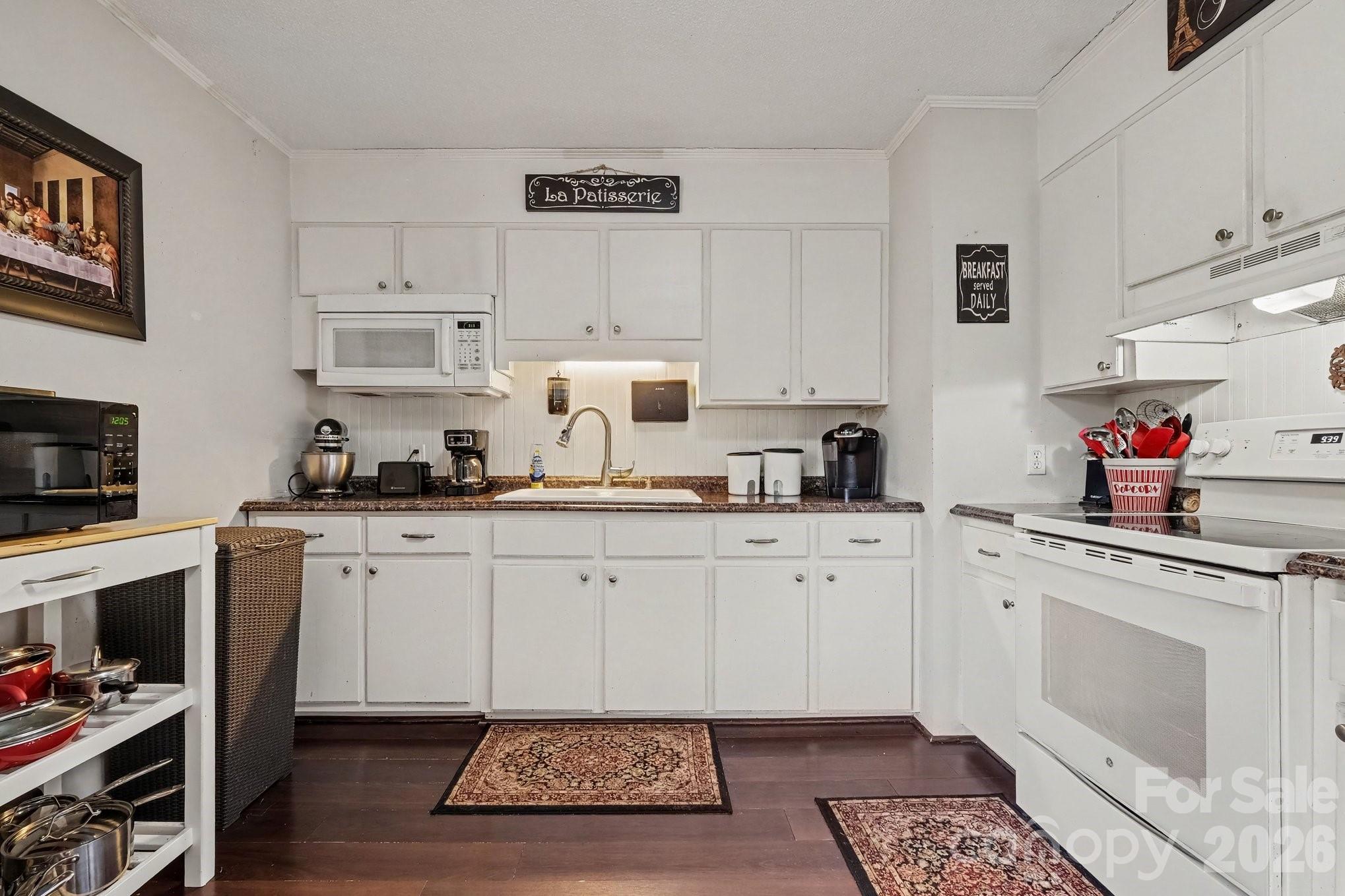 Kitchen view with white cabinets and white appliances. - 645 Pine Ridge Road, Chester