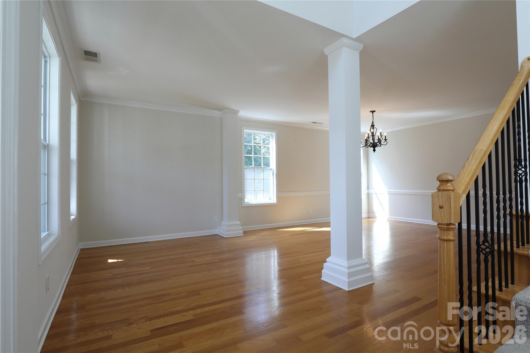Front living room had to option when built to be walled into a front office and could be easily updated to offer this additional space. - 18465 E Marbella Lane, Fort Mill