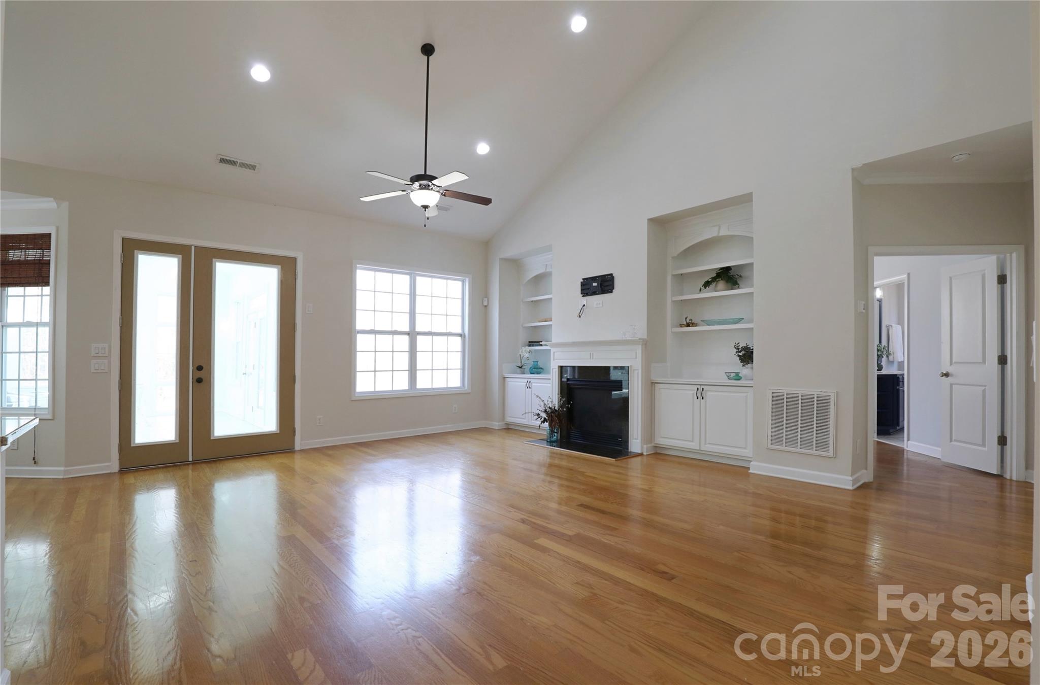 Welcoming great room centers the home and is open to kitchen and sunroom - 18465 E Marbella Lane, Fort Mill