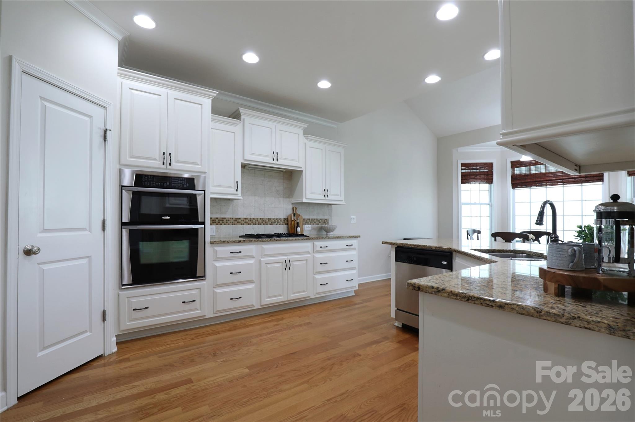 Walk in pantry and ample cabinetry in this gourmet kitchen - 18465 E Marbella Lane, Fort Mill